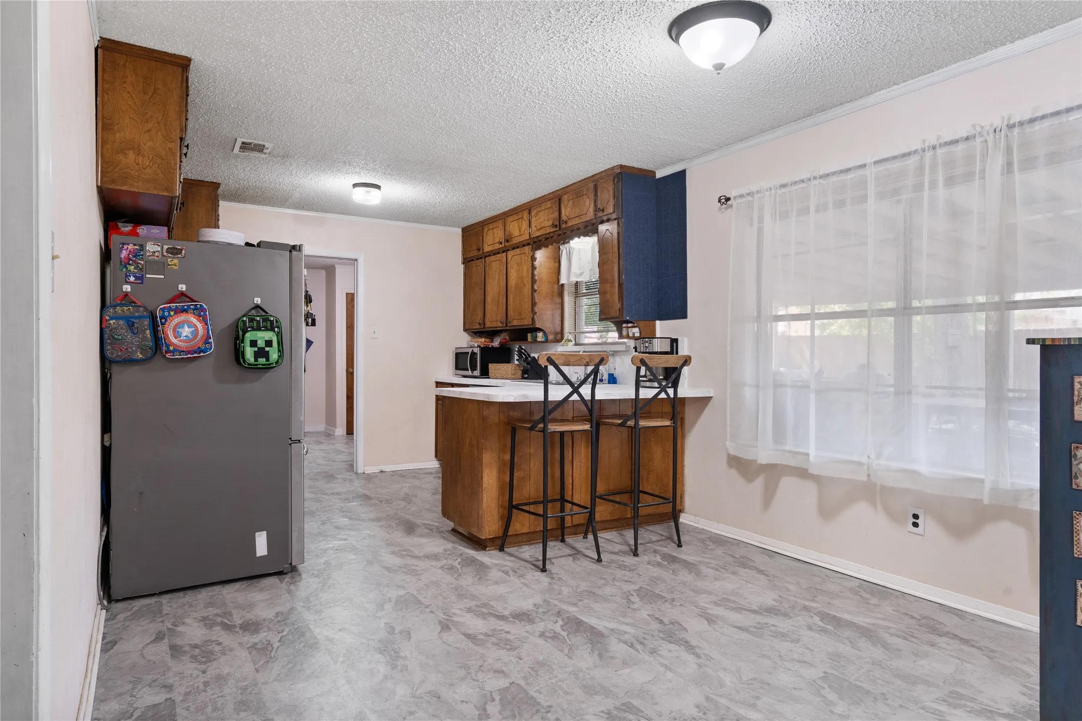Kitchen dining area with lots of natural light from the patio area.