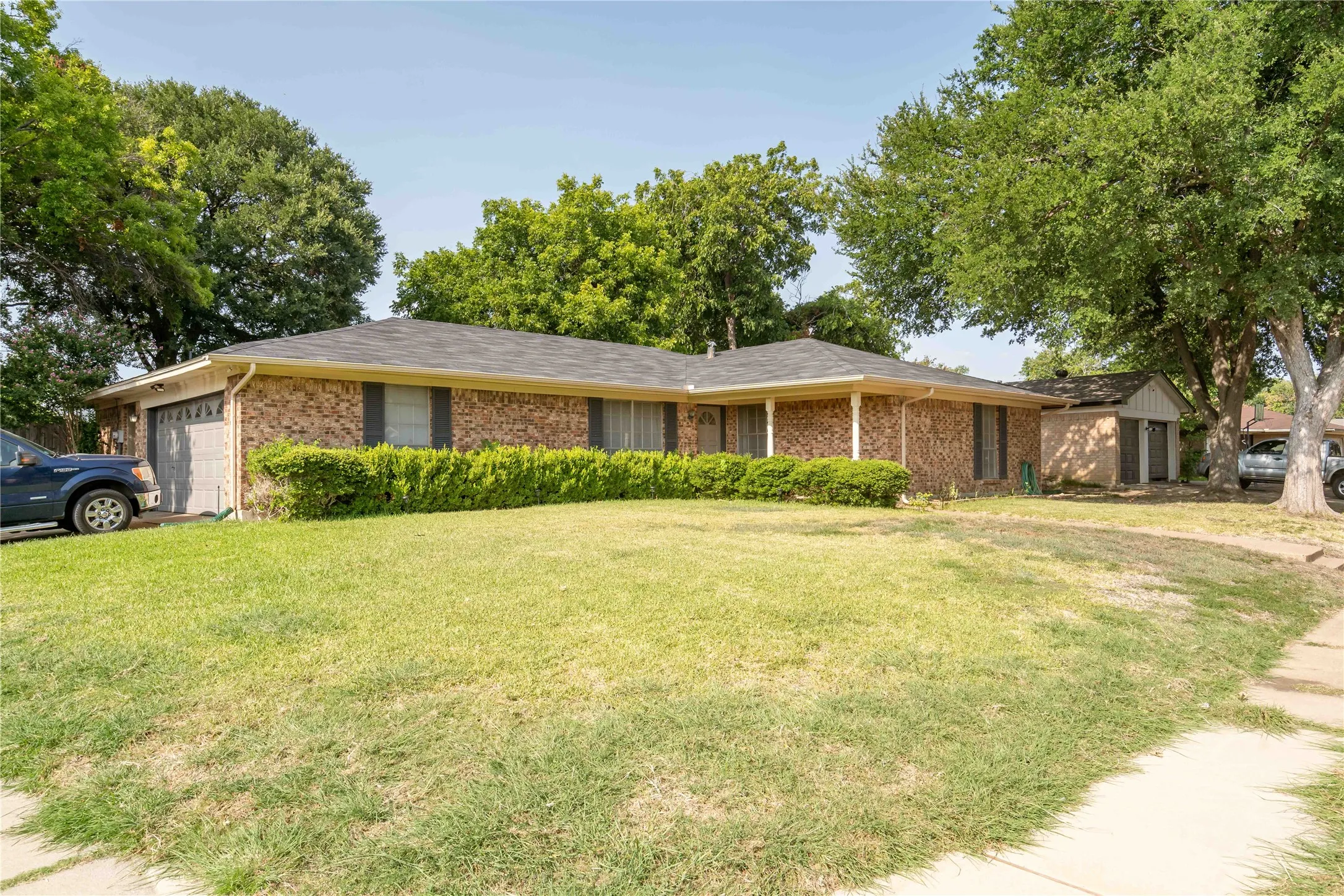 Corner lot with side garage and huge back yard.