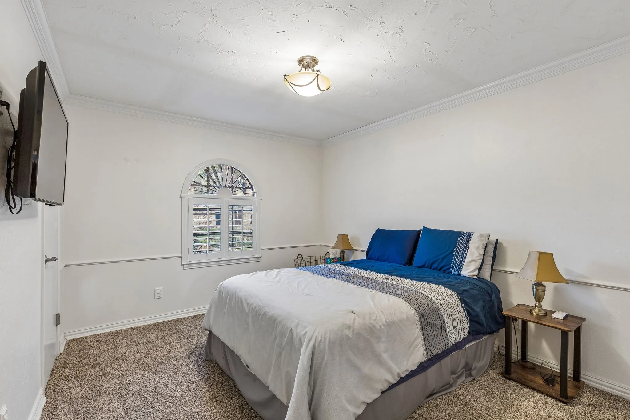 Bedroom with carpet and ornamental molding