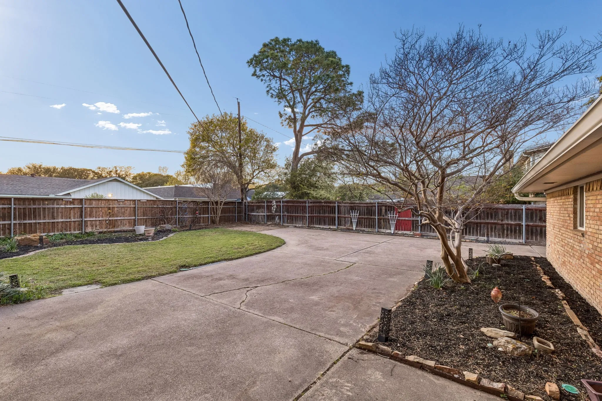 Fenced backyard featuring a patio area