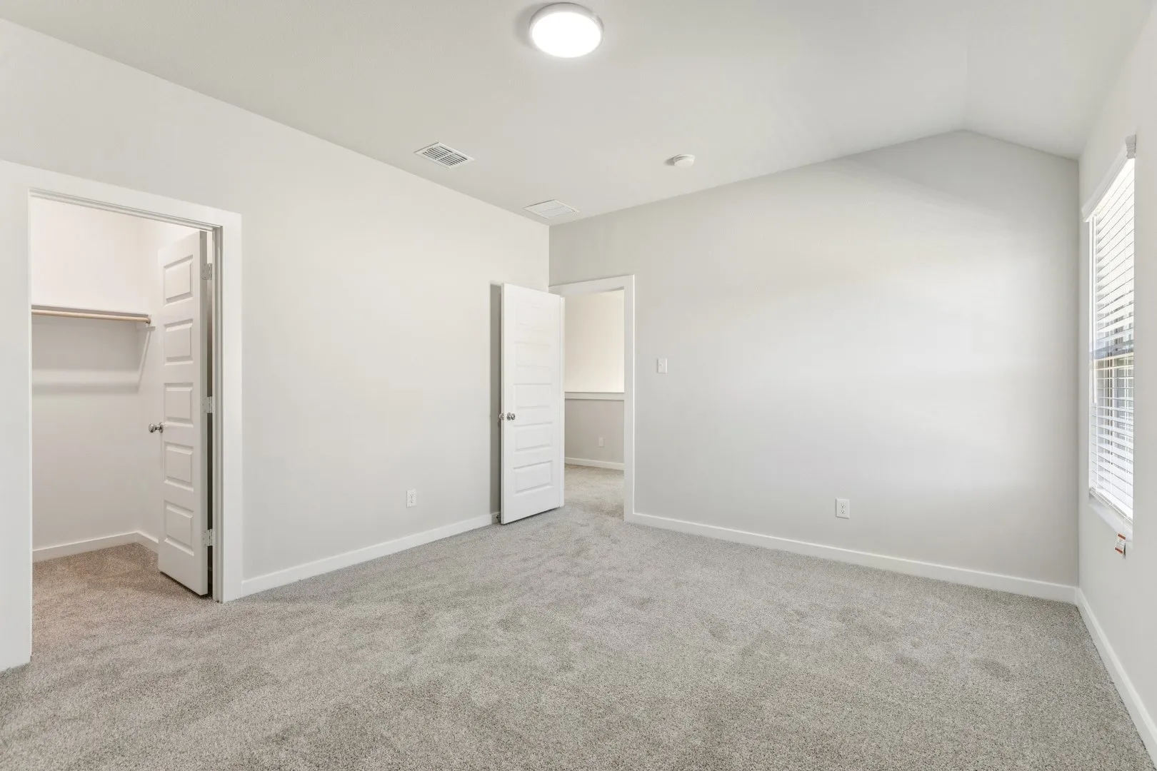 Bedroom in the Wimbledon home plan by Trophy Signature Homes – REPRESENTATIVE PHOTO