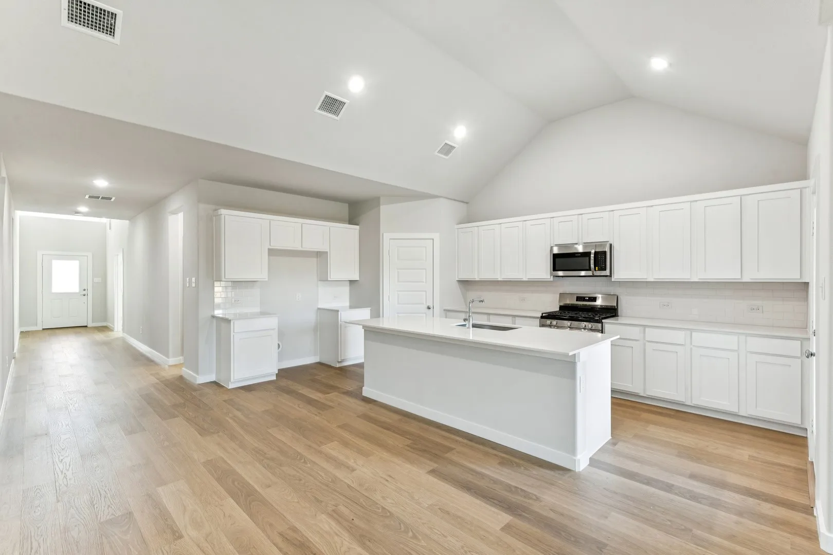Kitchen in the Wimbledon home plan by Trophy Signature Homes – REPRESENTATIVE PHOTO