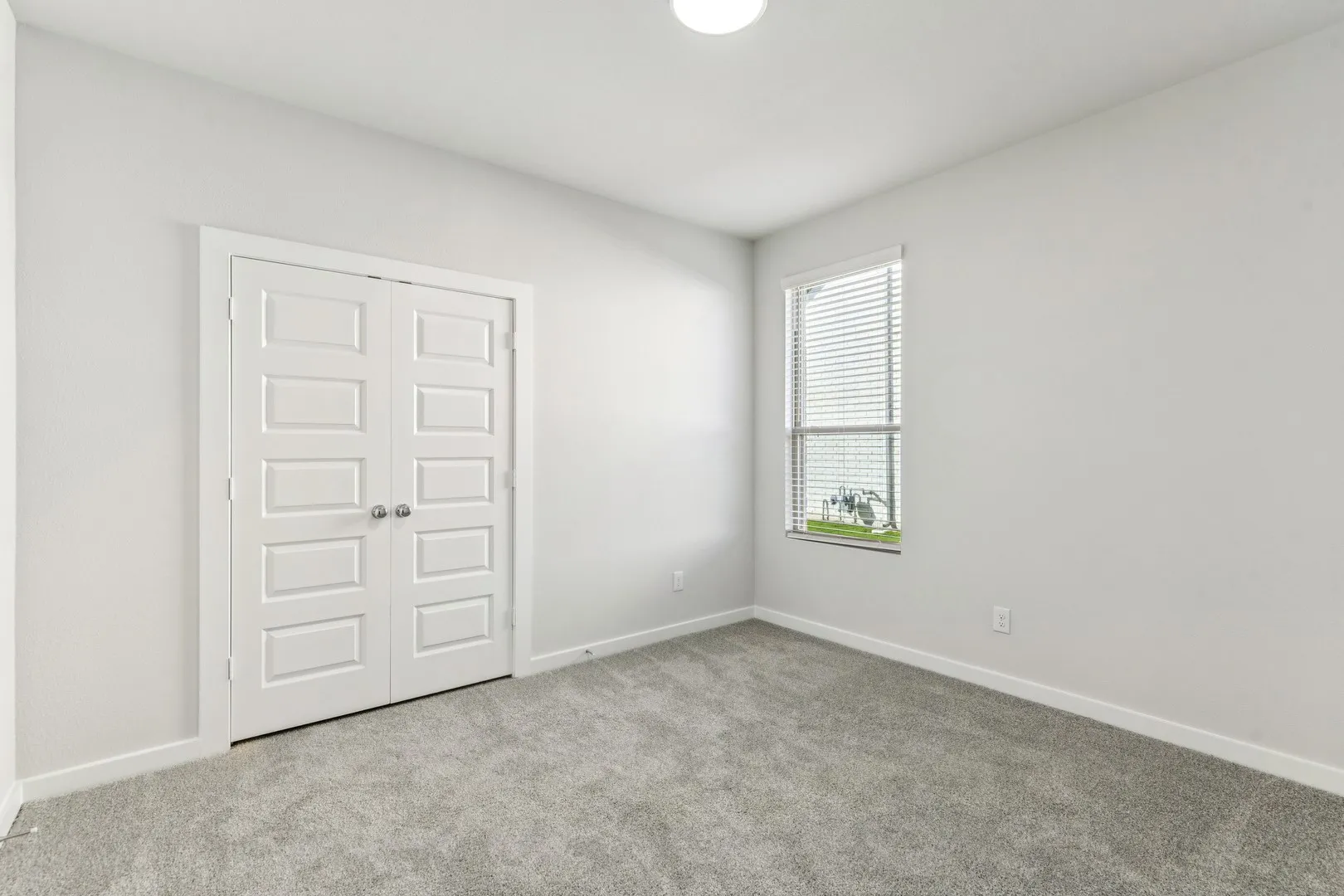 Bedroom in the Wimbledon home plan by Trophy Signature Homes – REPRESENTATIVE PHOTO