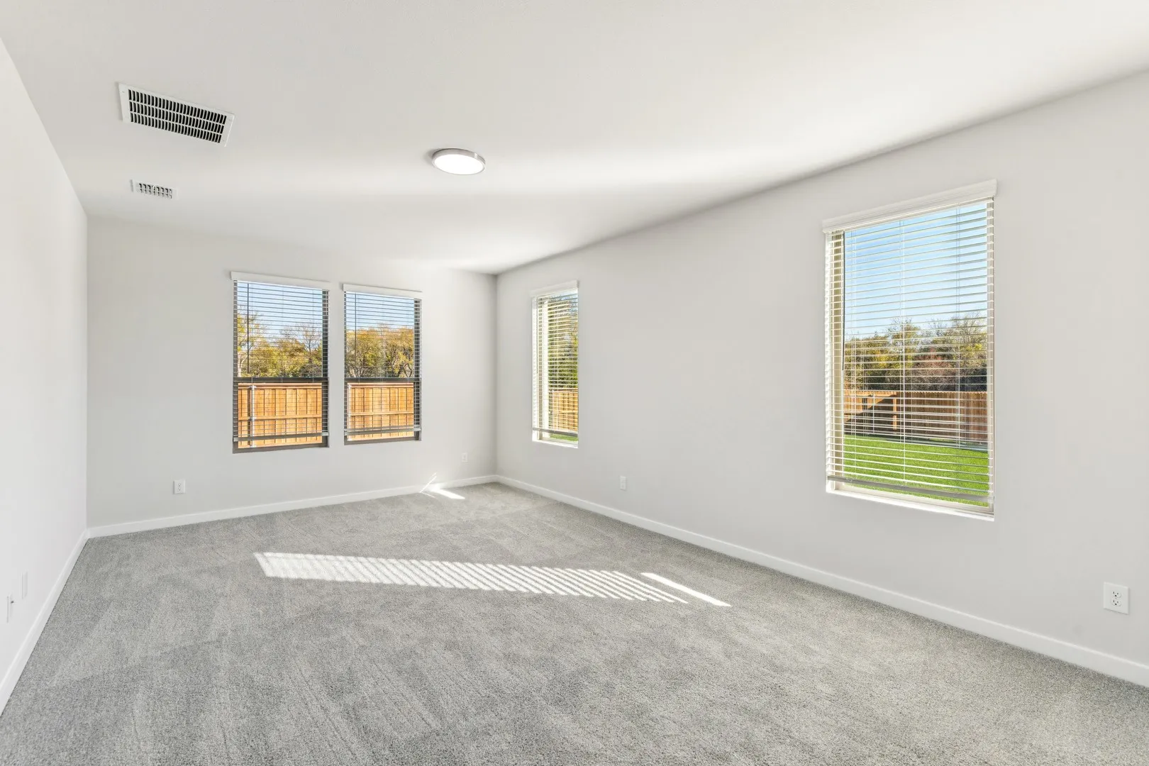 Primary Suite in the Wimbledon home plan by Trophy Signature Homes – REPRESENTATIVE PHOTO
