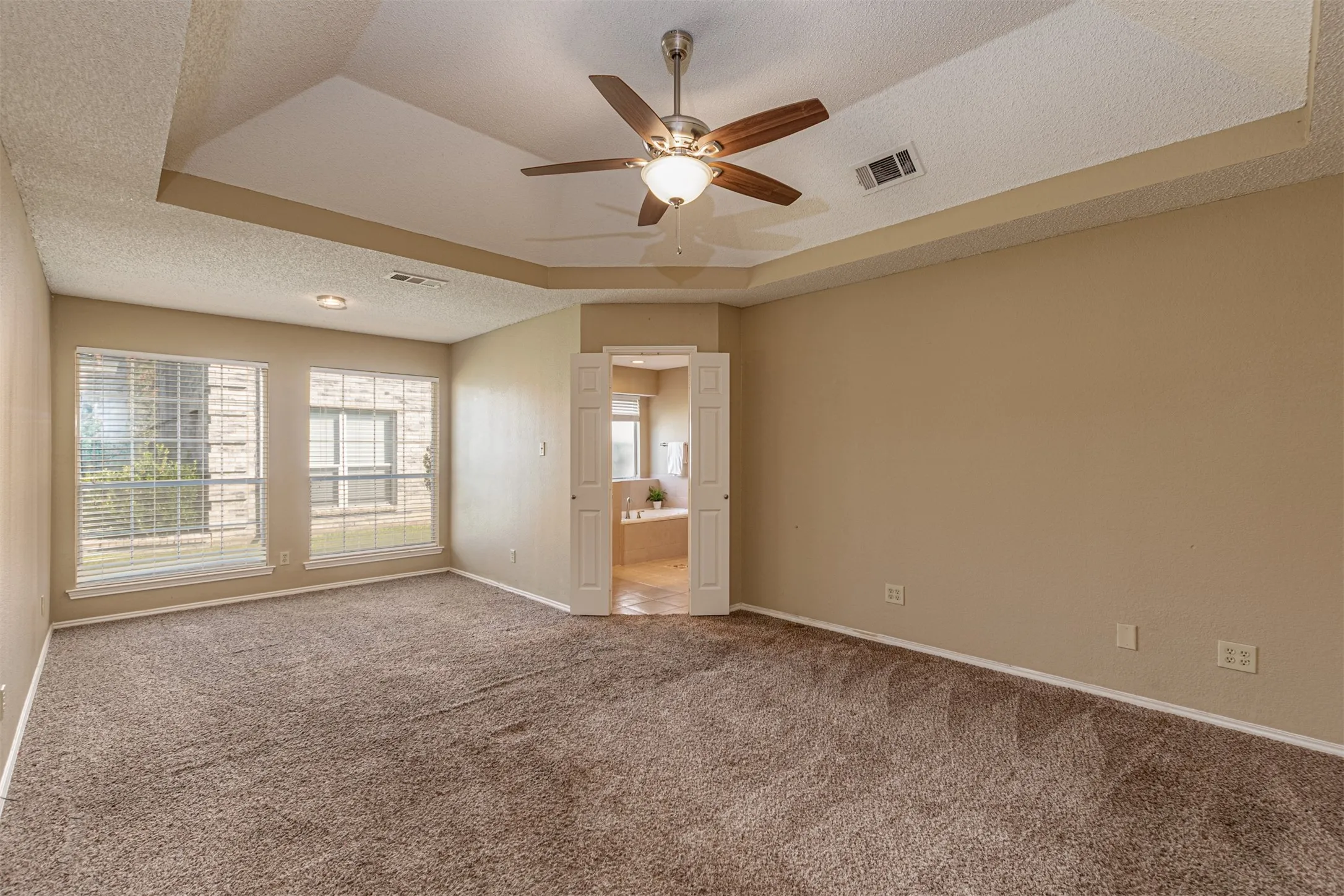 Spacious Primary Bedroom with sitting area.