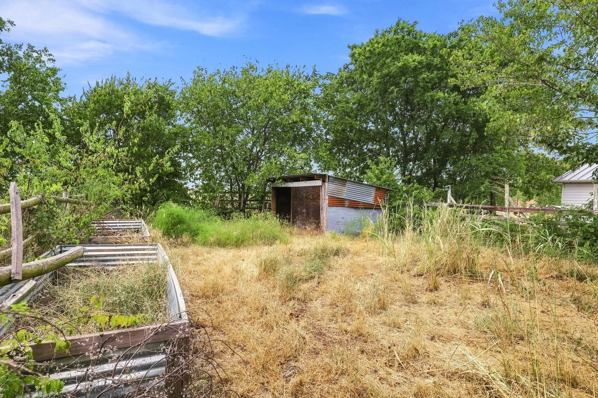 loafing shed and raised garden beds