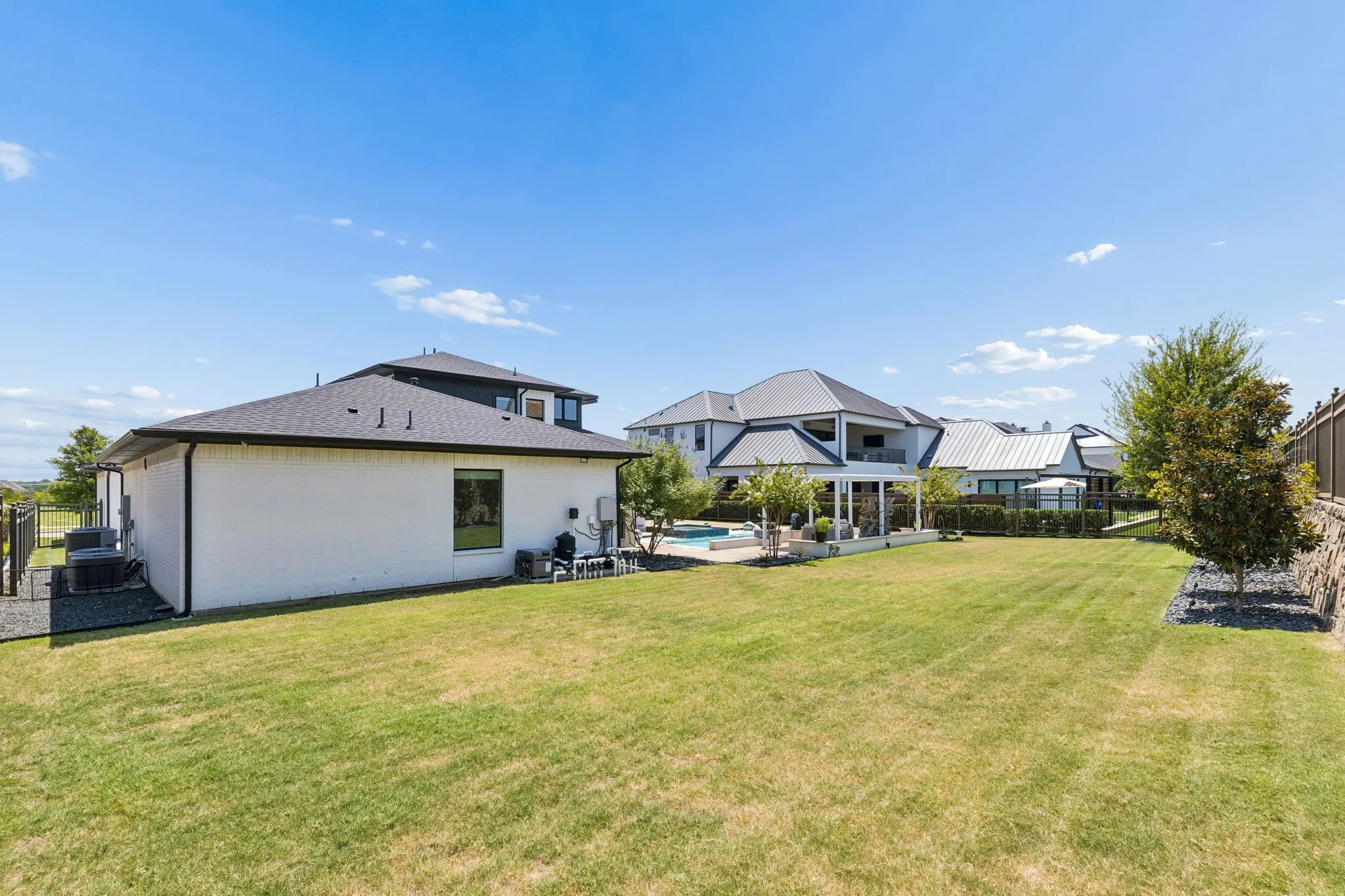Even with an incredible pool and patio, there is plenty of grassy backyard space!