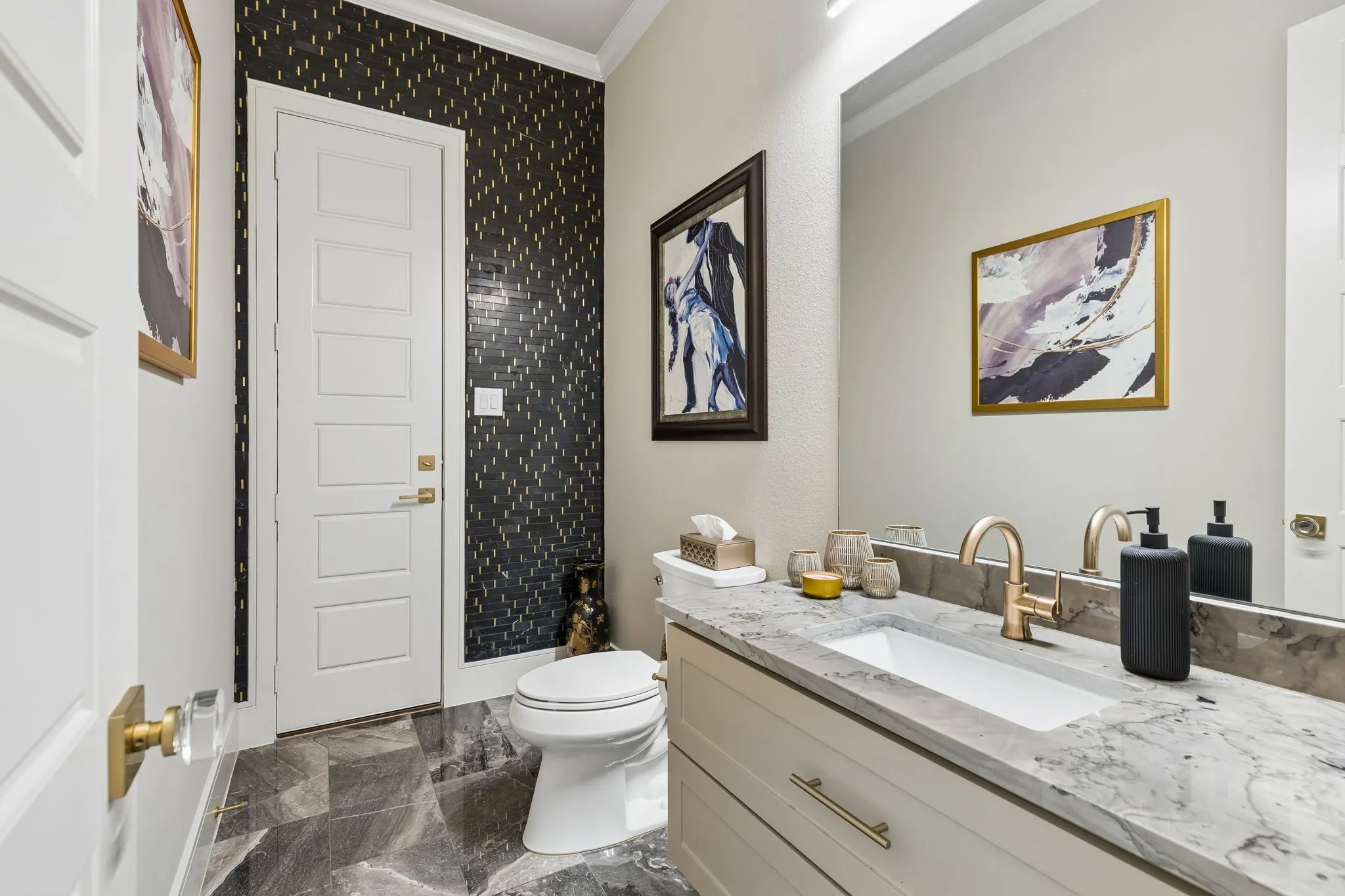 Downstairs guest bathroom with doorway to backyard patio