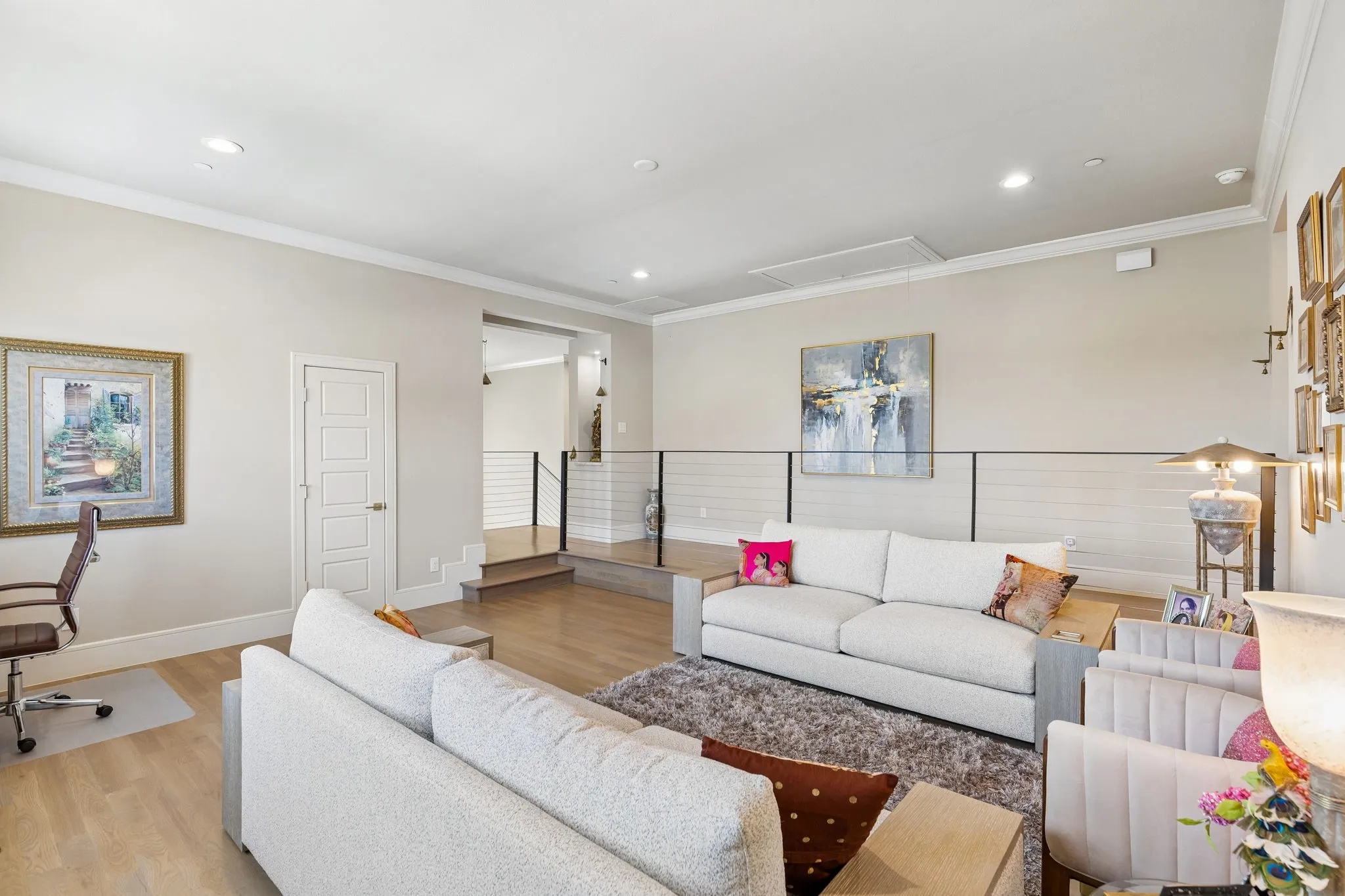Upstairs living room/game room with media storage closet