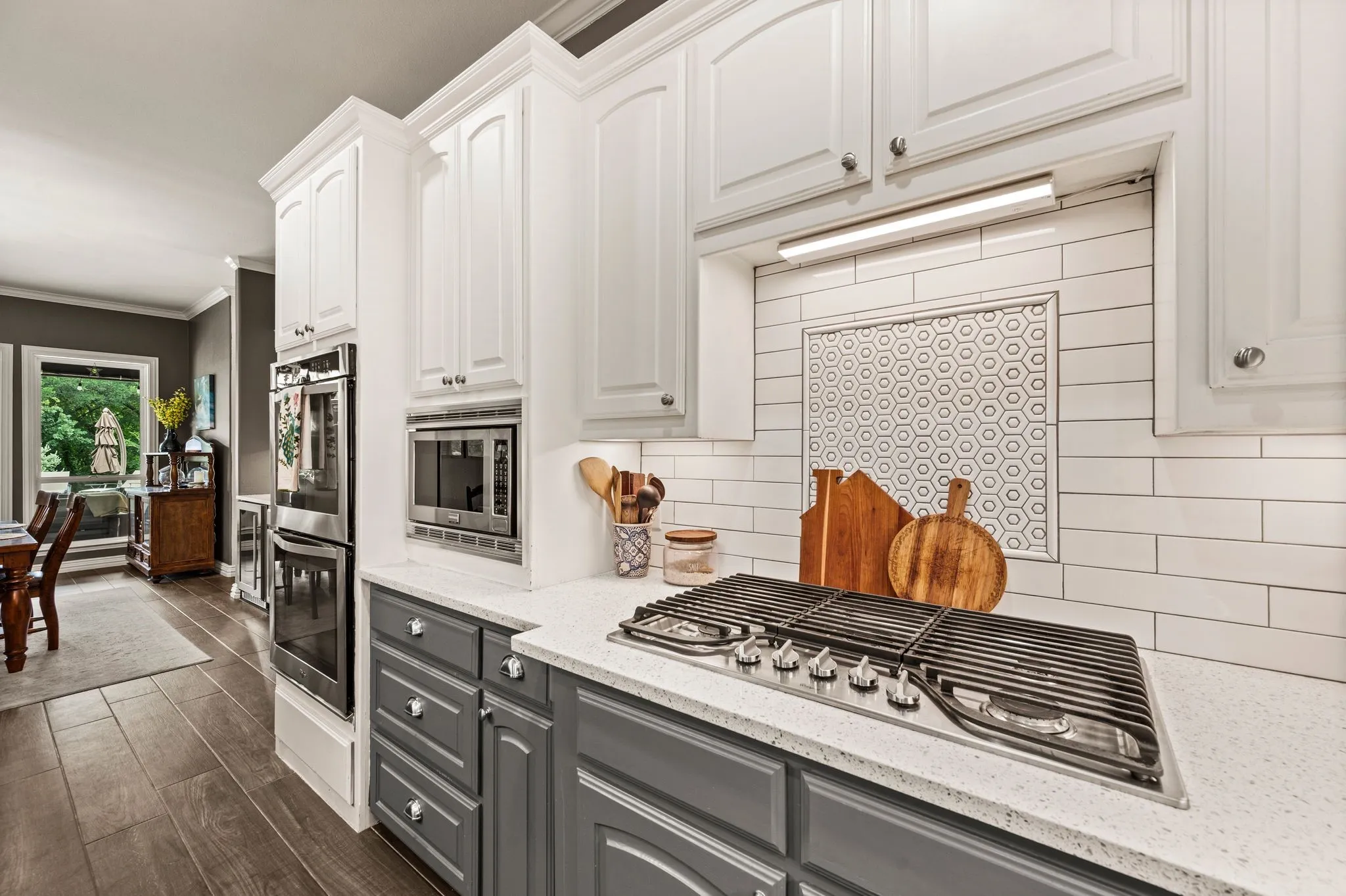 Gas cooktop in crisp white kitchen