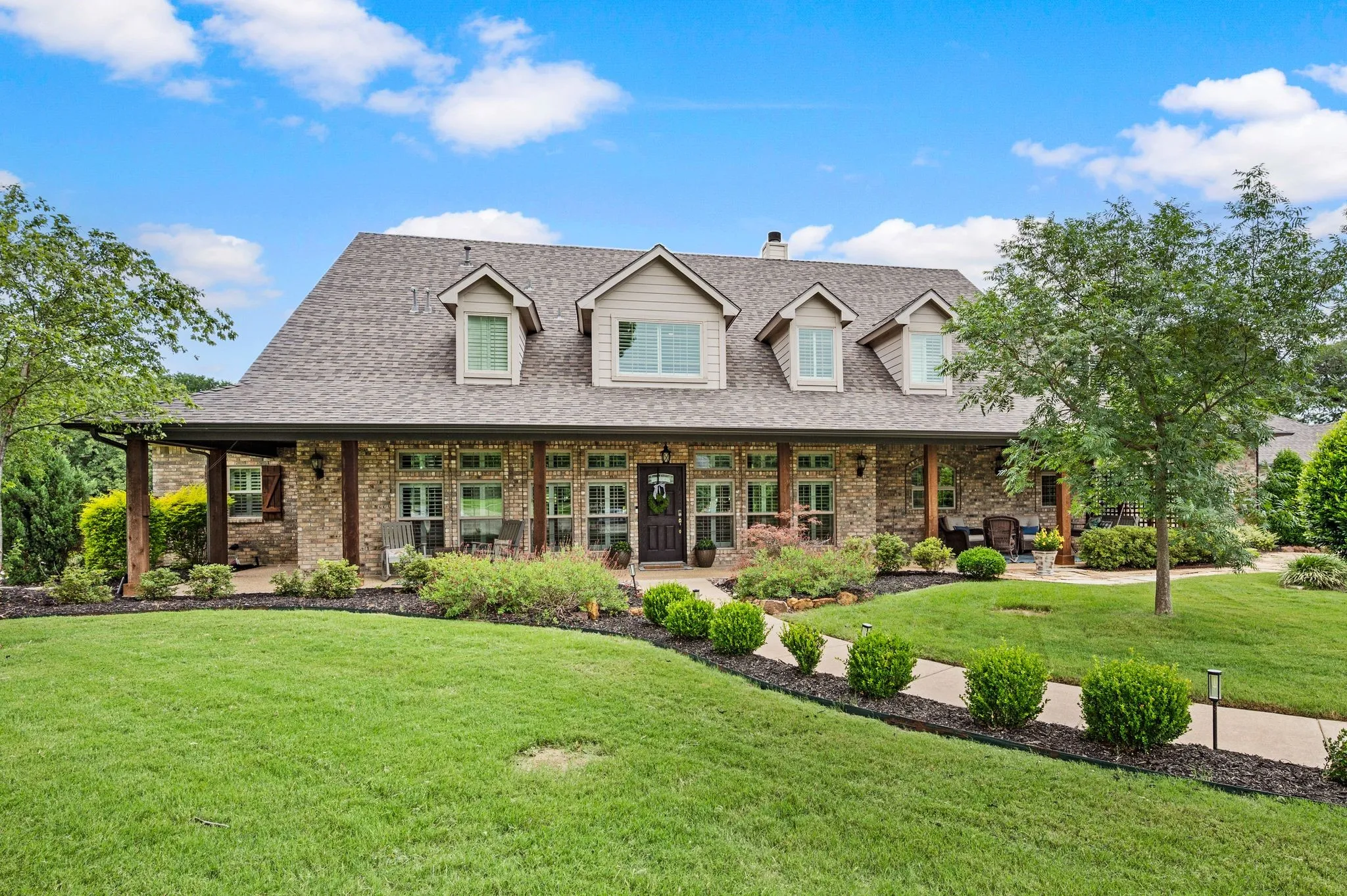 Sited perfectly on 2 acres backing to a ranch with lots of trees