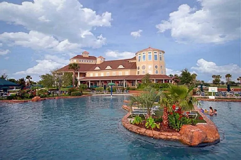 Expansive Savannah Town Community complex with water-front recreation featuring tennis courts, multiple pools, a water slide, and a community center.