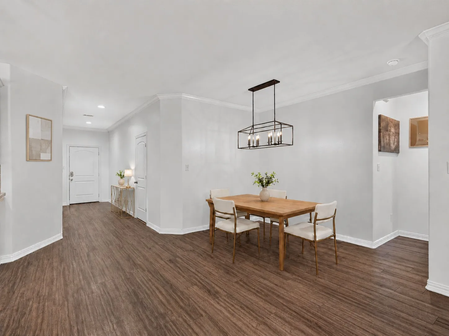 Dining area with large windows overlooking the front yard. Virtually staged.