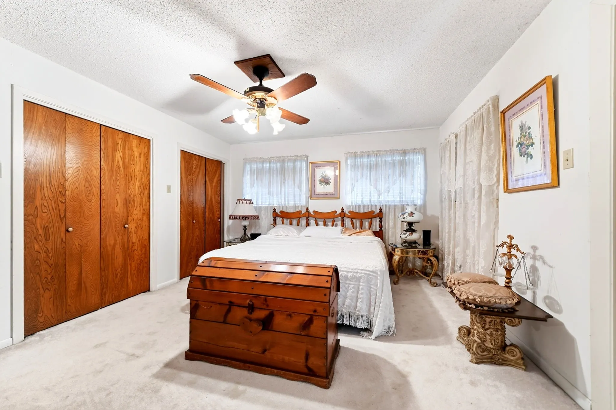 Light-colored wall-to-wall carpeting and white walls