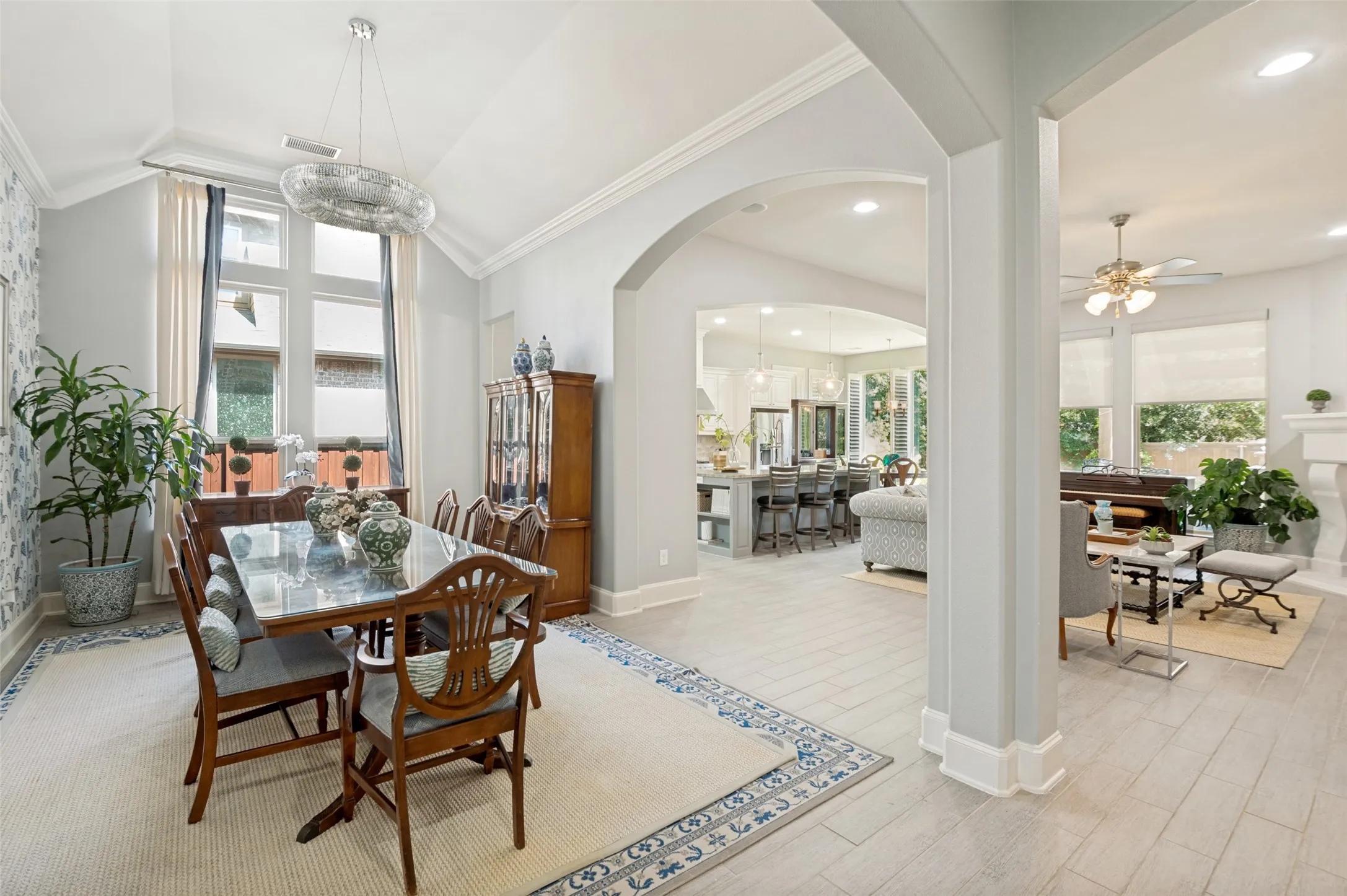 Elegant dining room with abundant natural light, soaring ceilings, and an open design, creating the perfect space for hosting family dinners and entertaining guests.