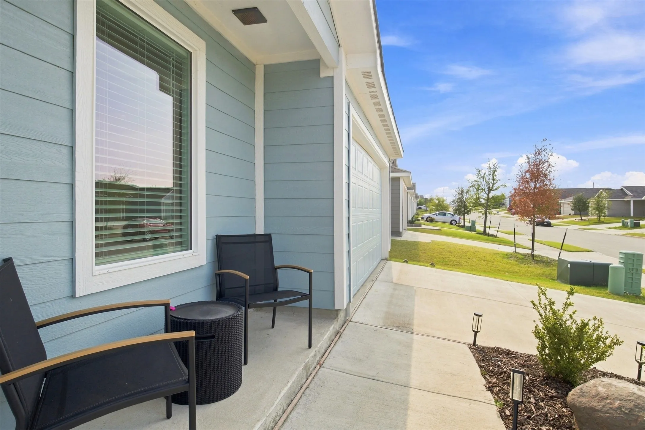 Light blue horizontal siding with white trim