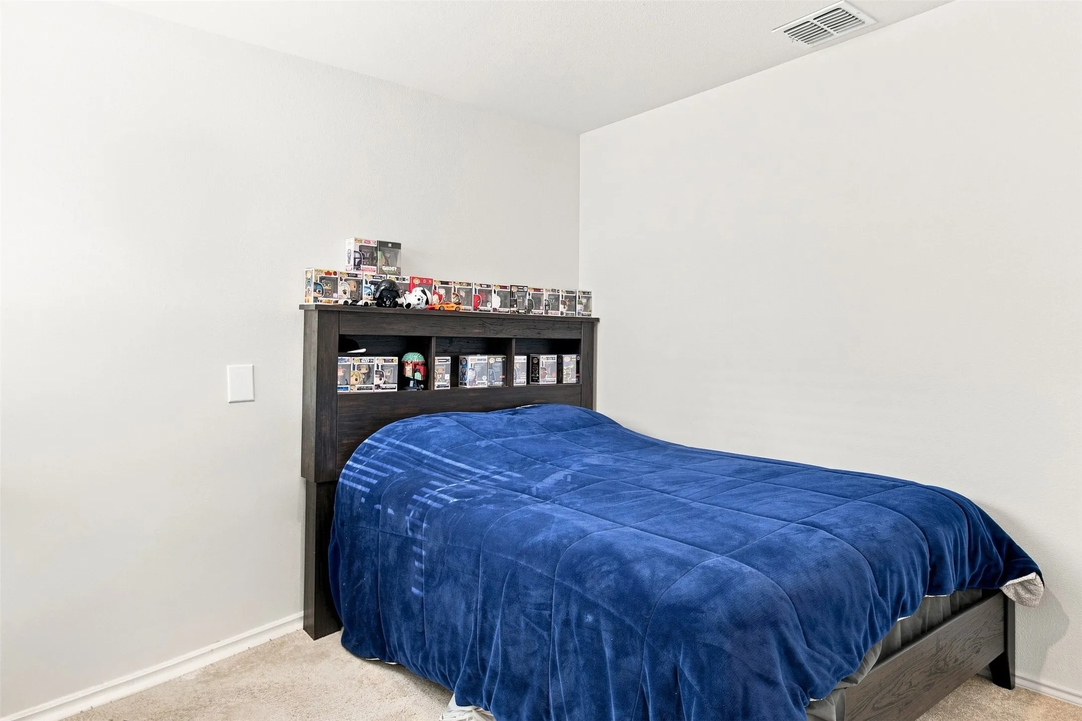 Neutral wall color, carpet flooring, and white trim