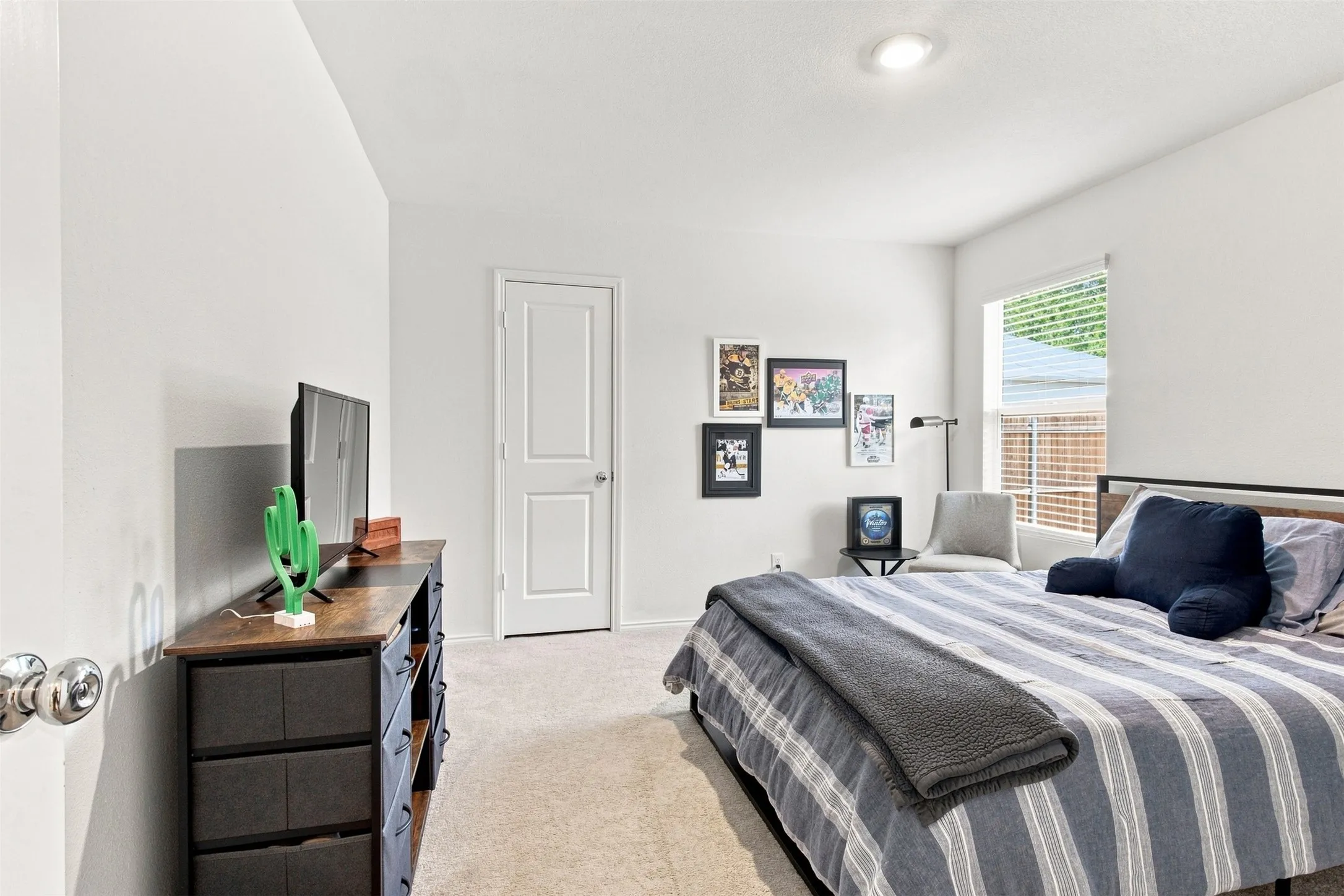 Wall-to-wall carpeting, recessed lighting, and a white paneled door