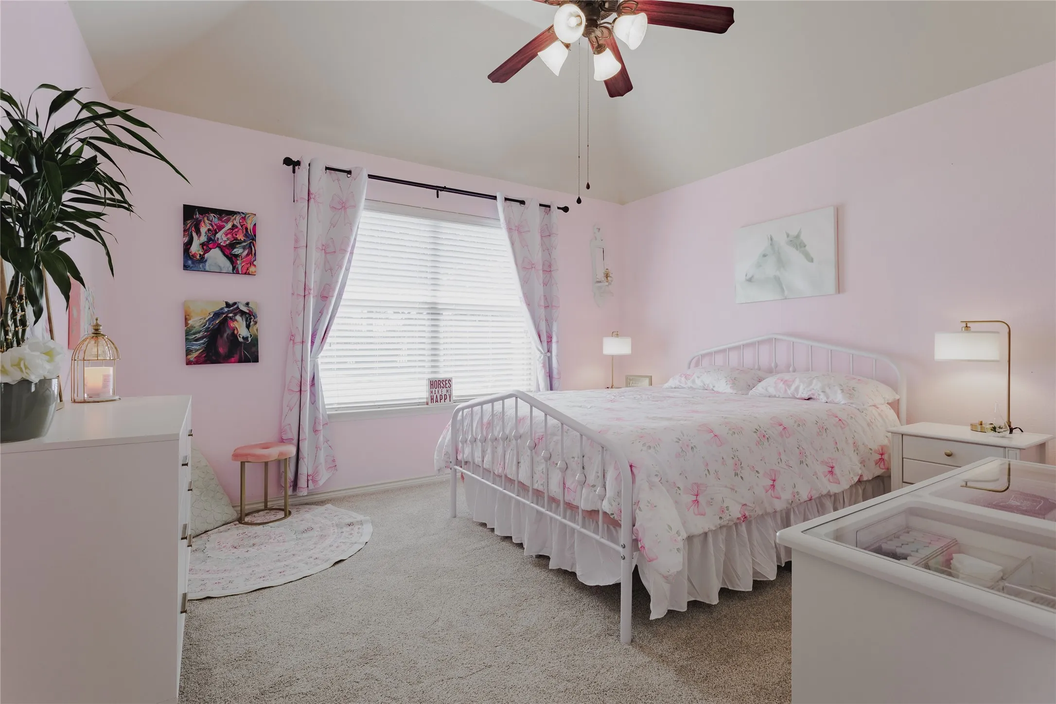Vaulted ceiling with a ceiling fan, carpeted flooring, and a window with blinds