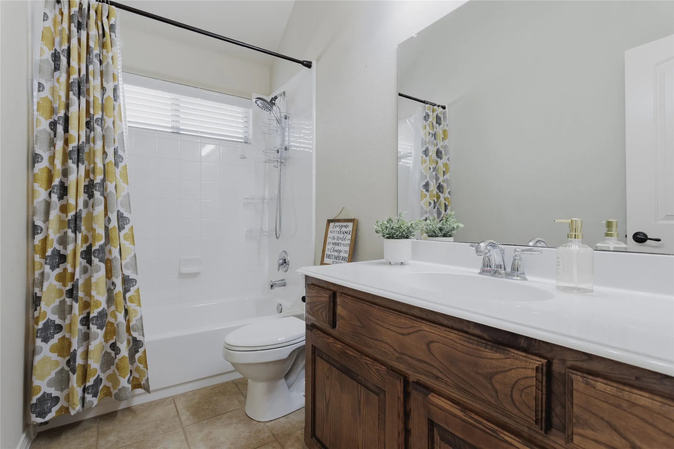 Wood-finish vanity with integrated sink and chrome faucet