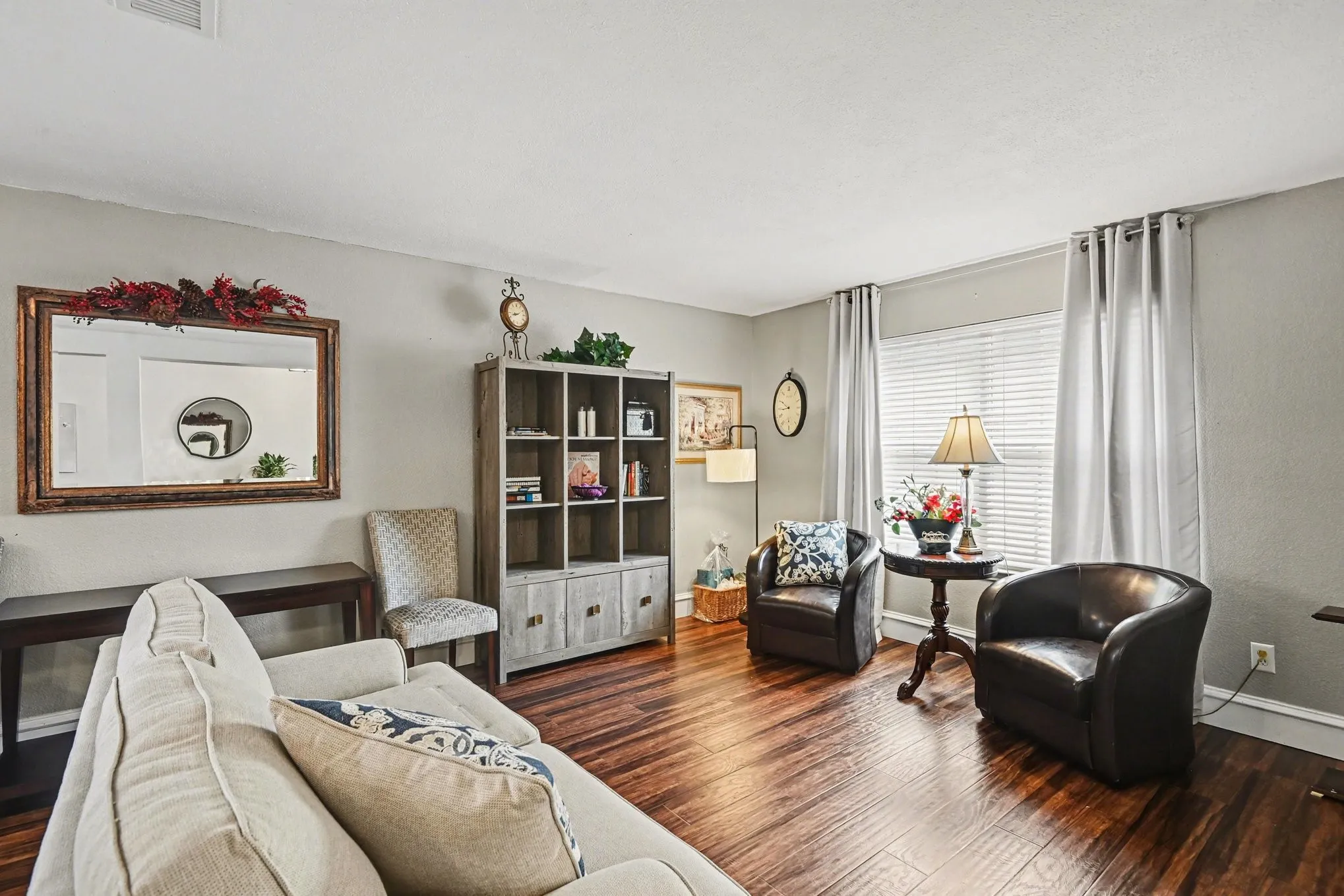 Rich wood-finish flooring complements light-toned walls