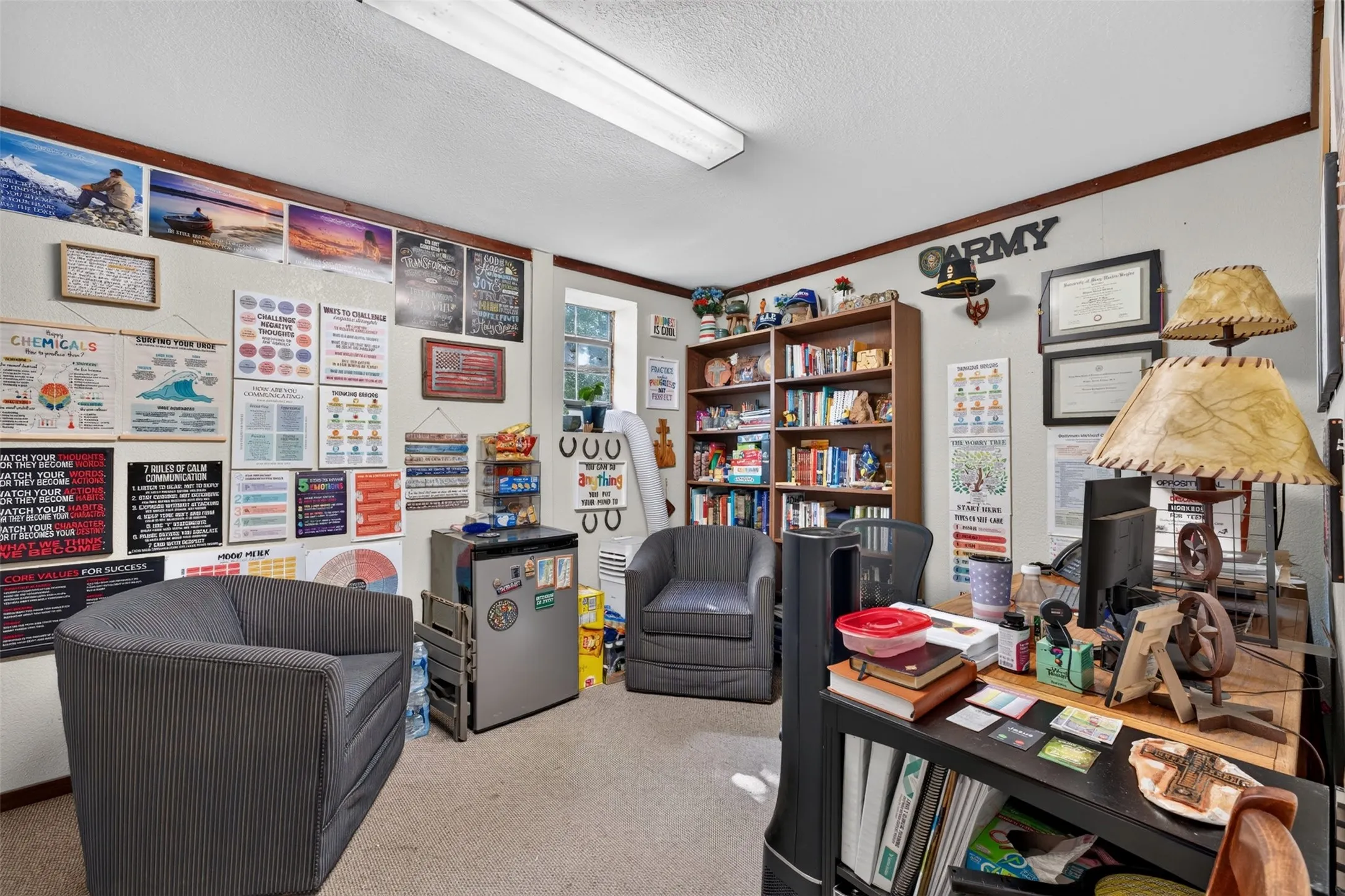 Recessed windows, built-in shelving, wood-finish trim, and carpeted flooring