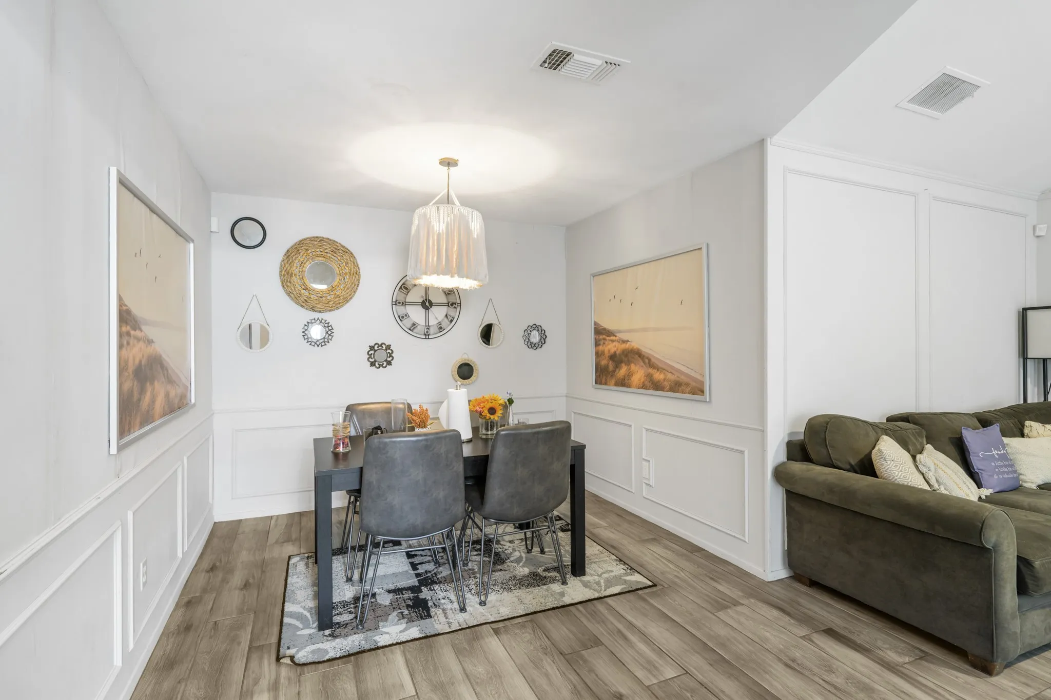 Dining area features decorative lighting.
