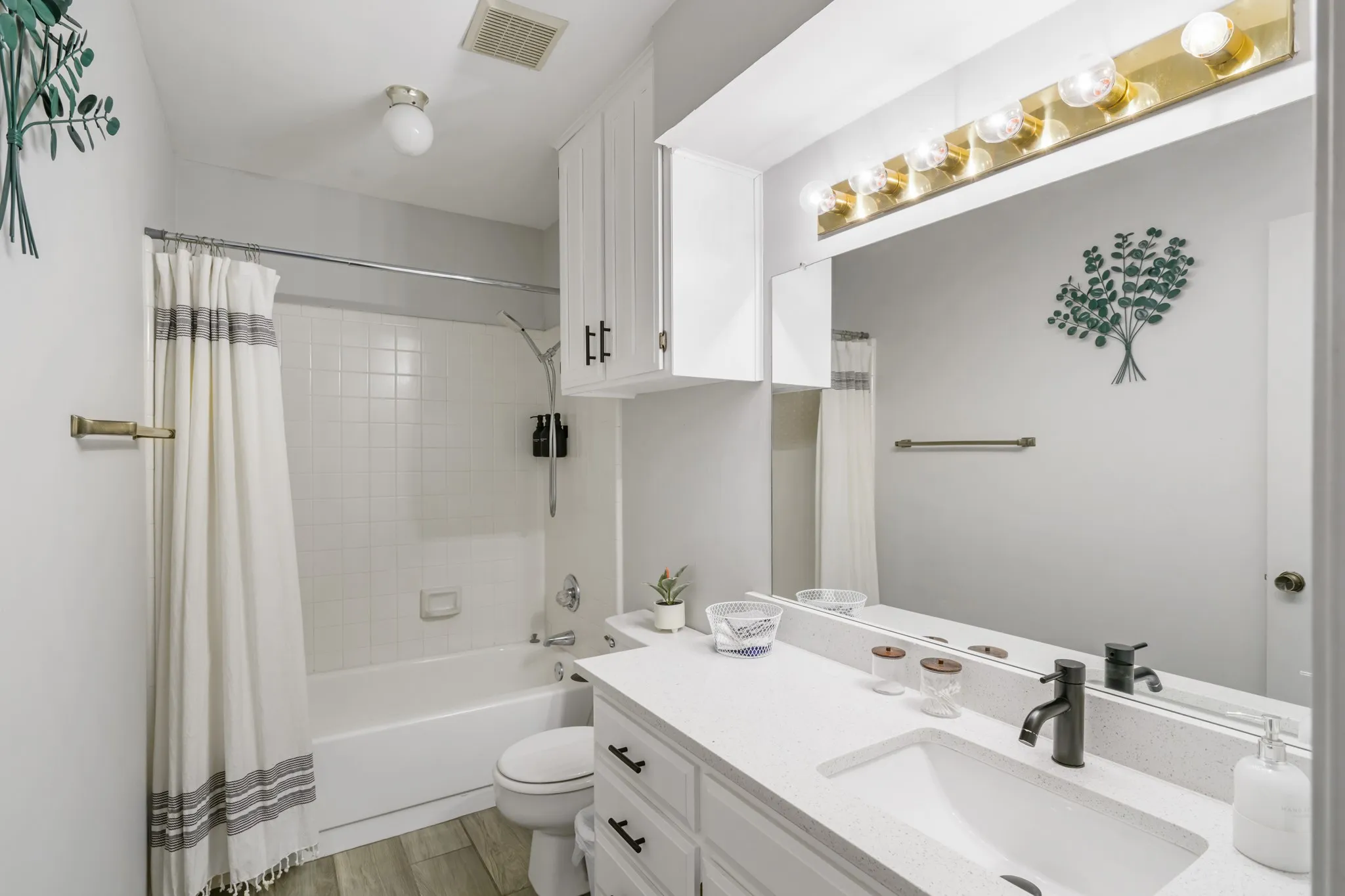 Secondary bathroom has built in storage.