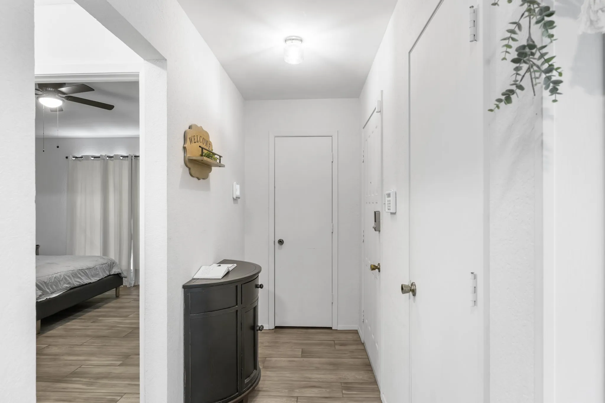 Upon Entry the hall has two closets for storage, with the master bedroom adjacent to the entry.