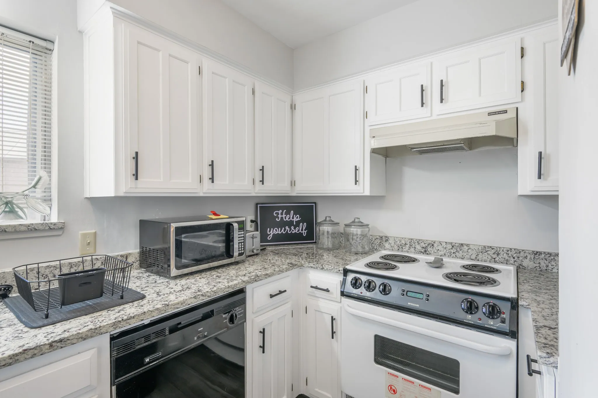 Kitchen has a closet pantry, dishwasher and fridge.