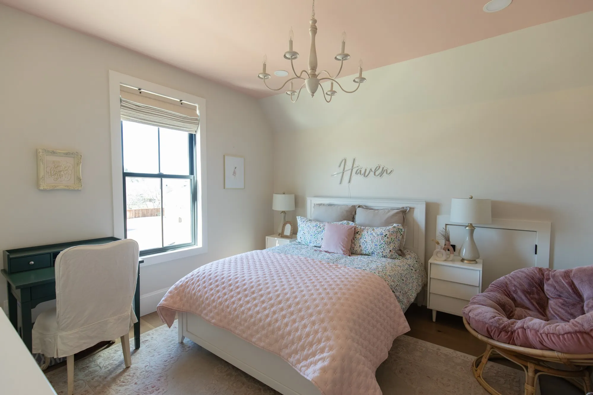 Bedroom featuring suspended lighting, lofted ceiling, and wood finished floors
