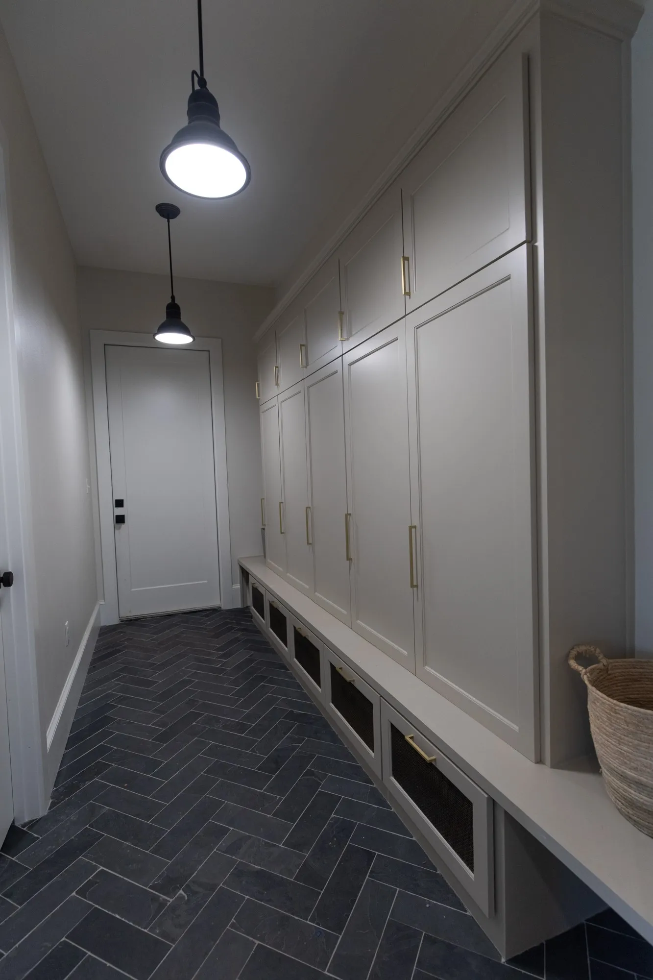 Mudroom with baseboards and brick patterned floors
