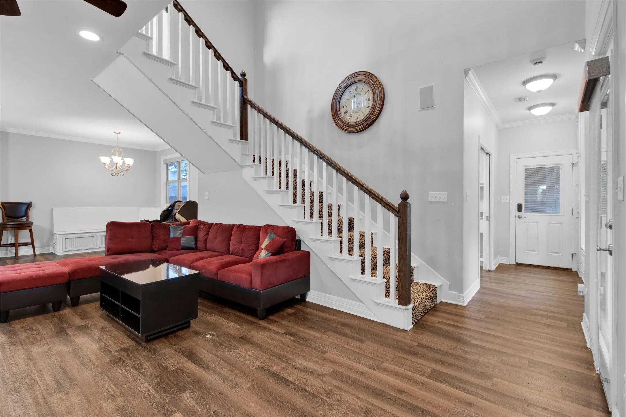 Two-story entryway with wood-finish flooring