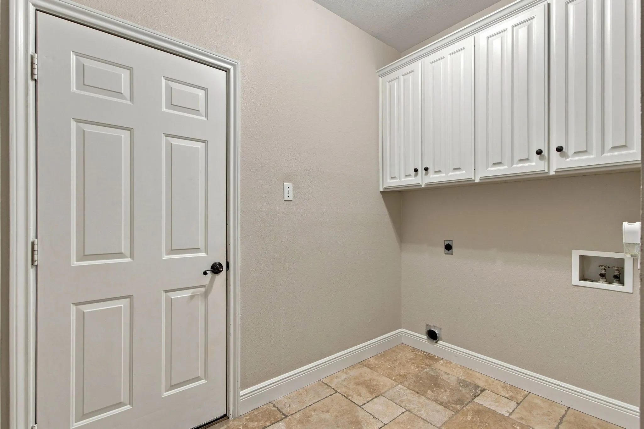 Utility room with built in 36" upper cabinets.