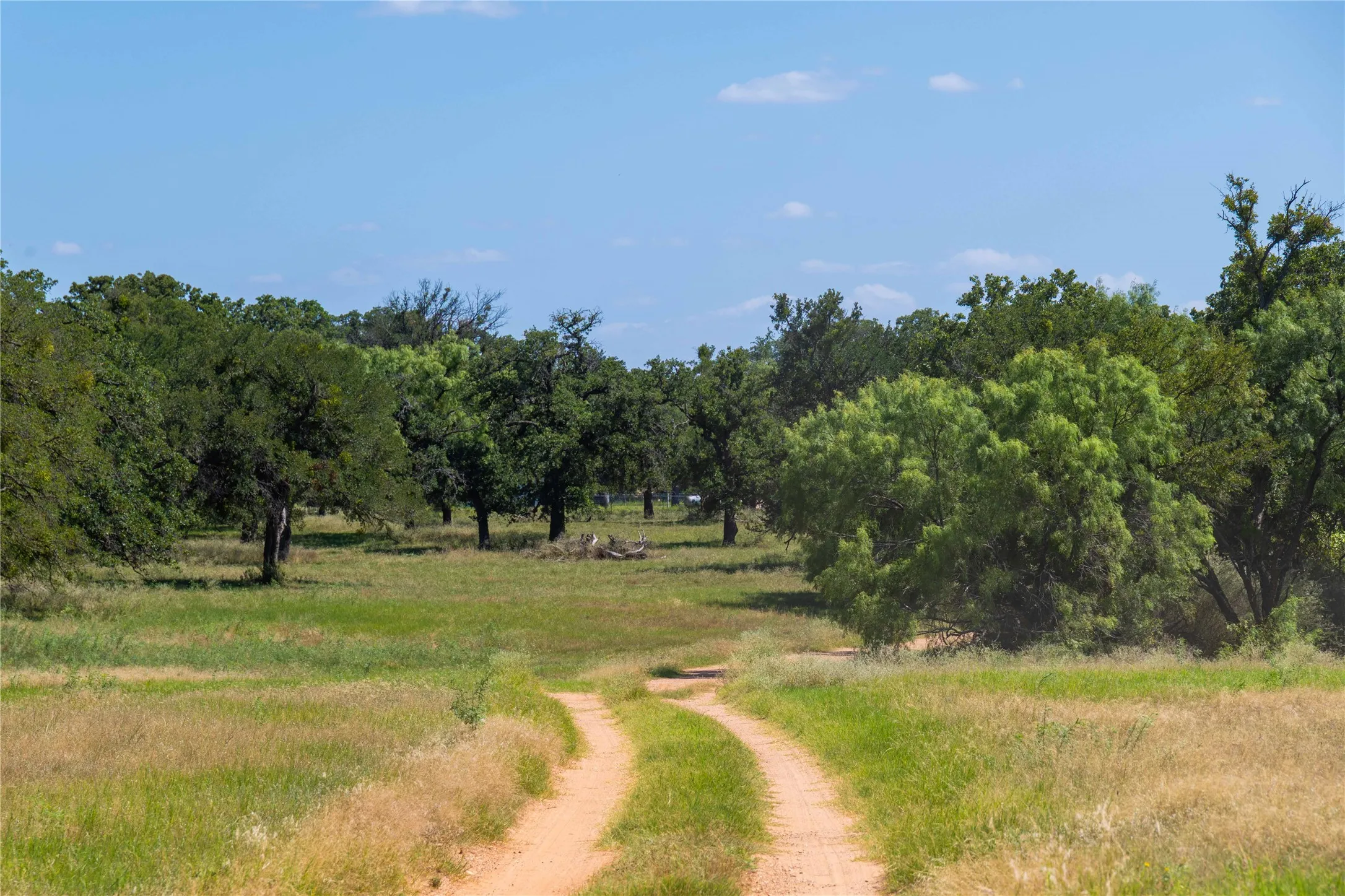 County road entrance with private drive