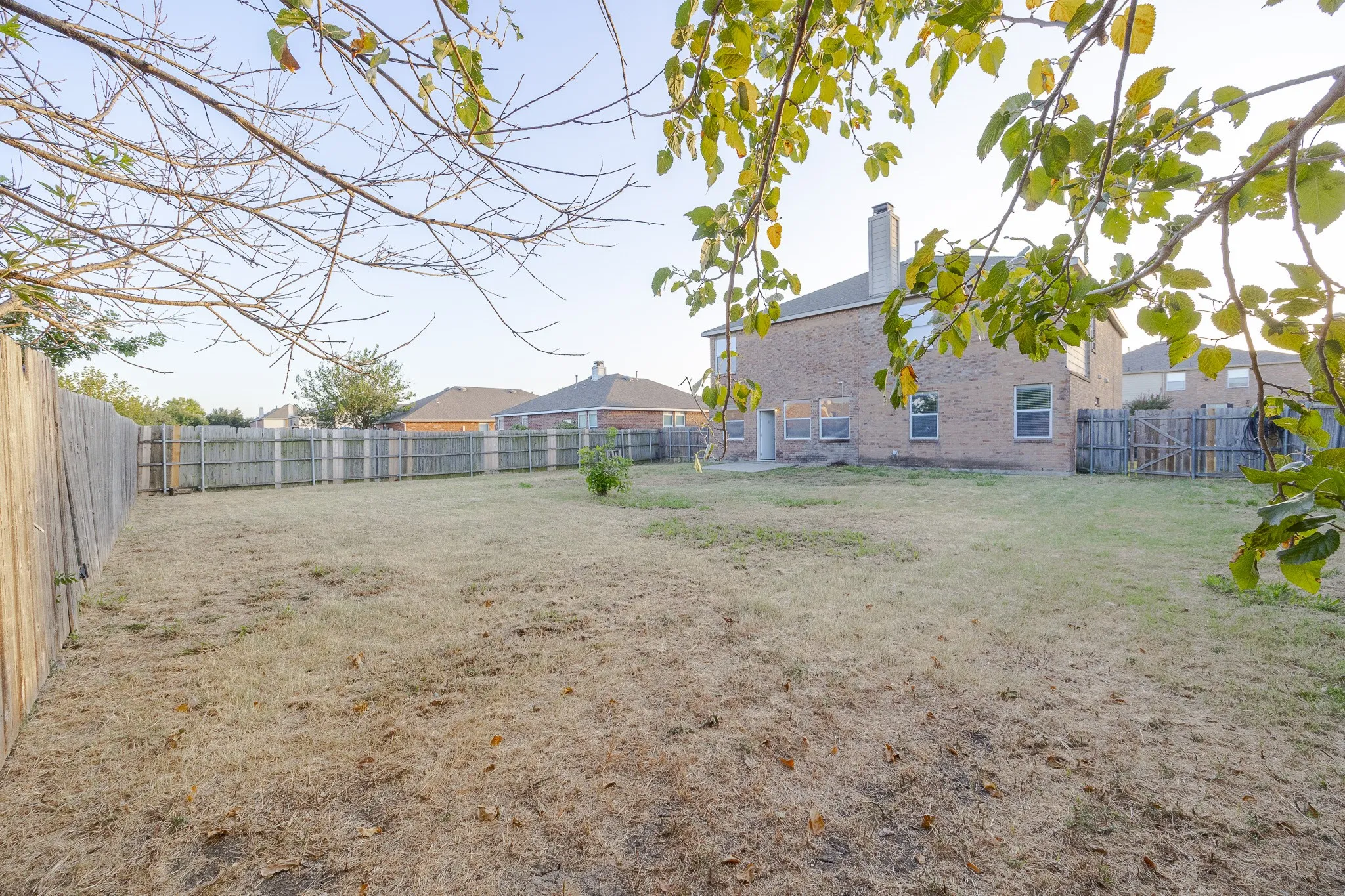 Expansive backyard with a full privacy fence