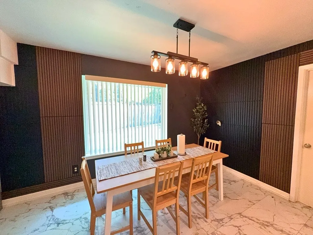 Separate dining area with decorative lighting