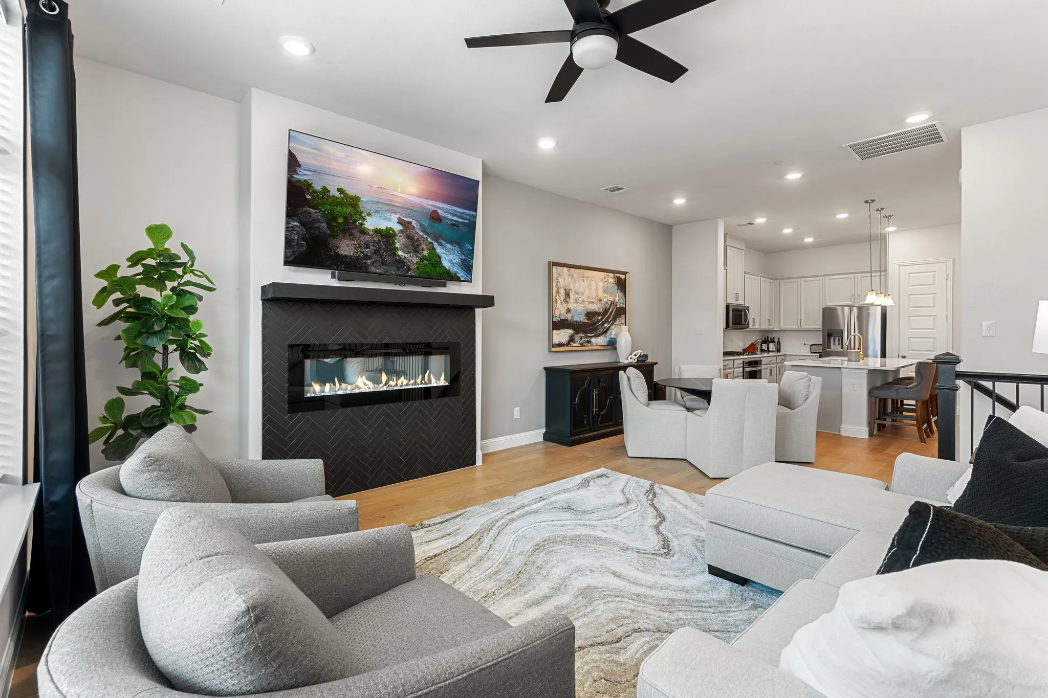 Living room featuring light hardwood / wood-style flooring and ceiling fan