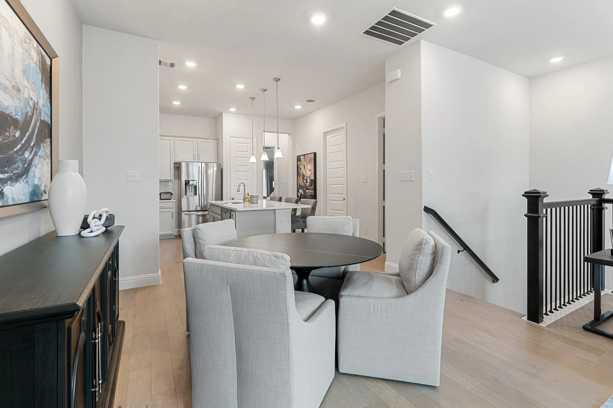 Dining area with sink and light hardwood / wood-style floors