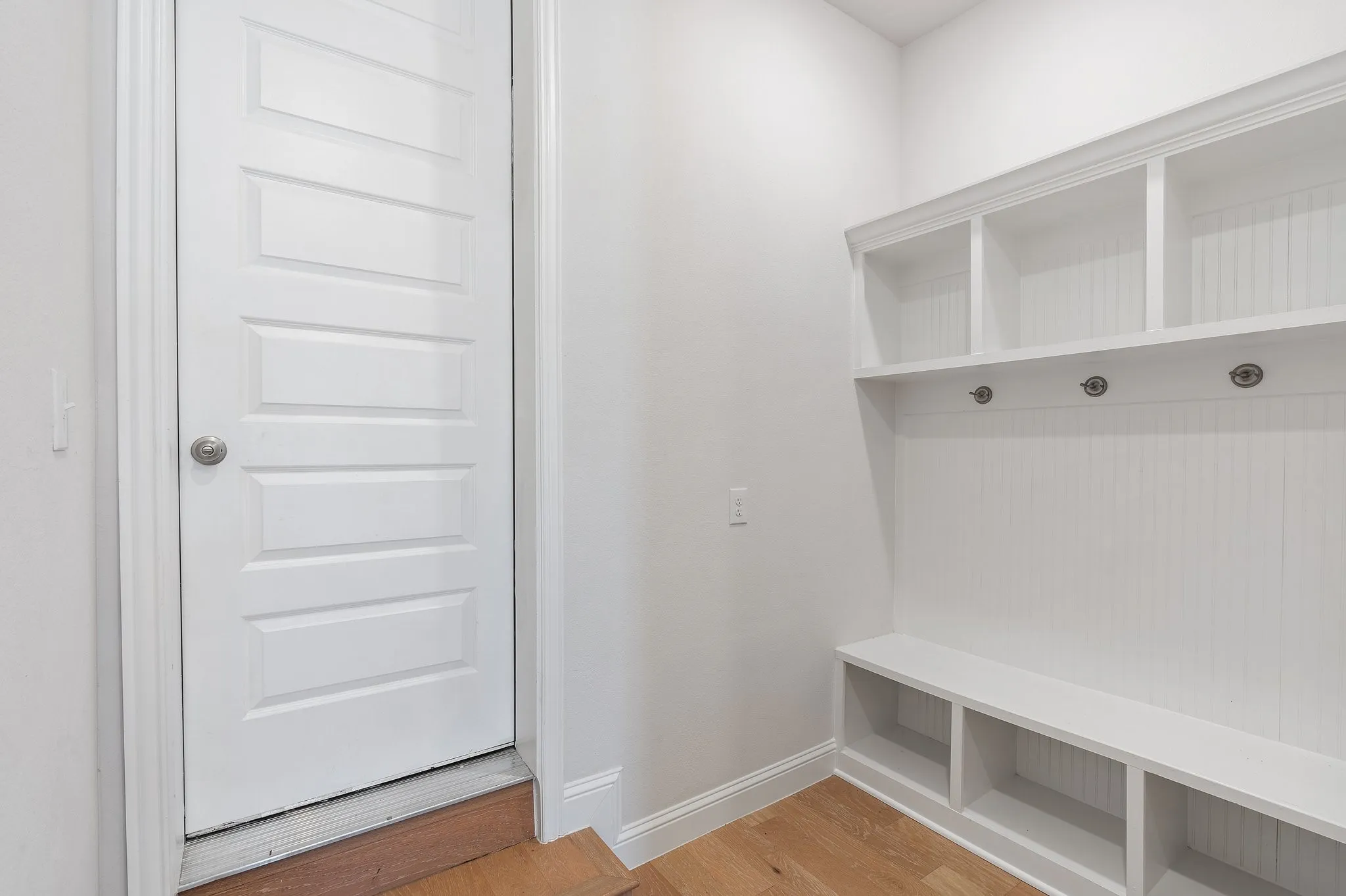 Mudroom with hardwood / wood-style flooring