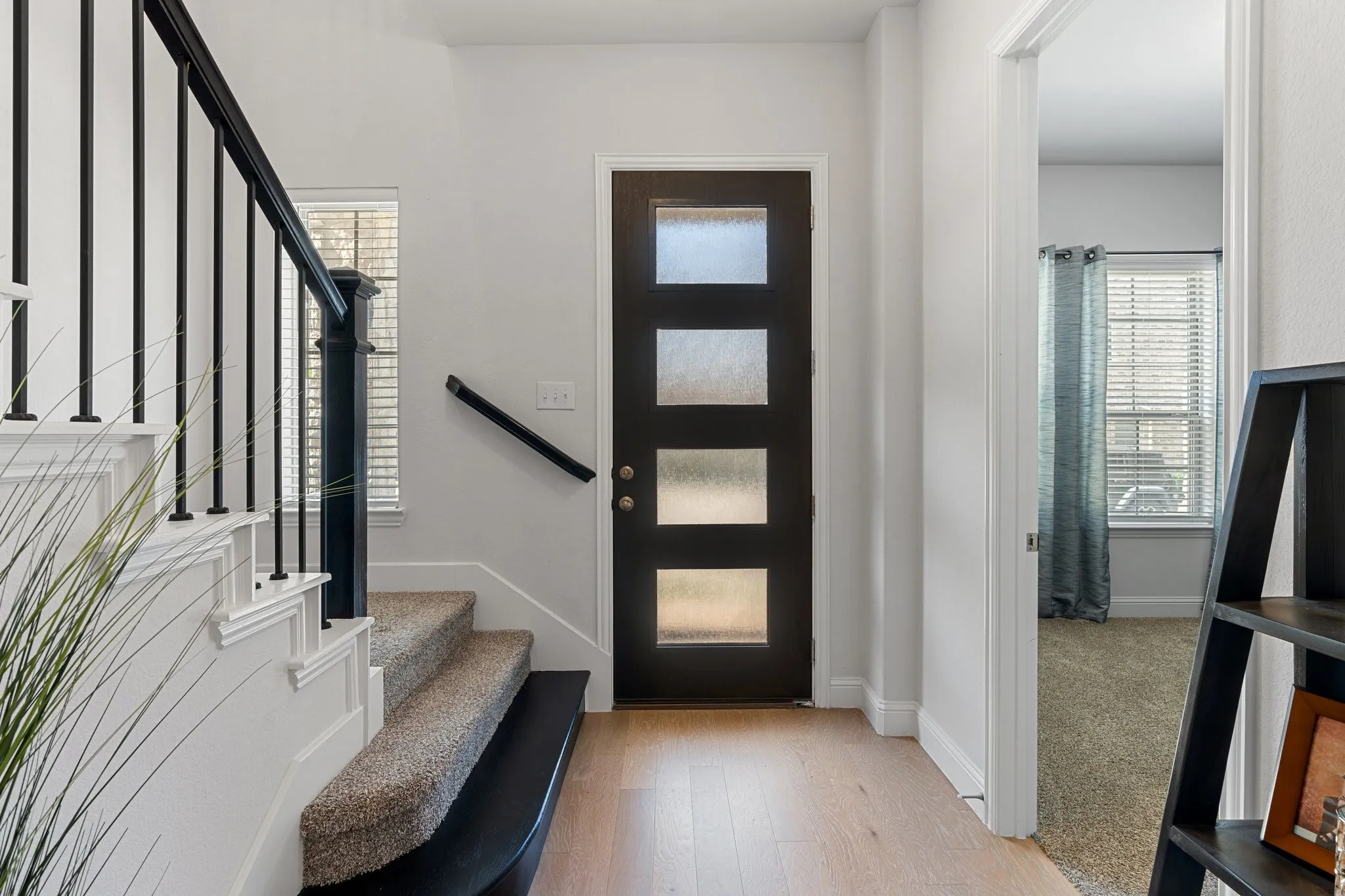 Entrance foyer featuring a wealth of natural light and hardwood / wood-style floors