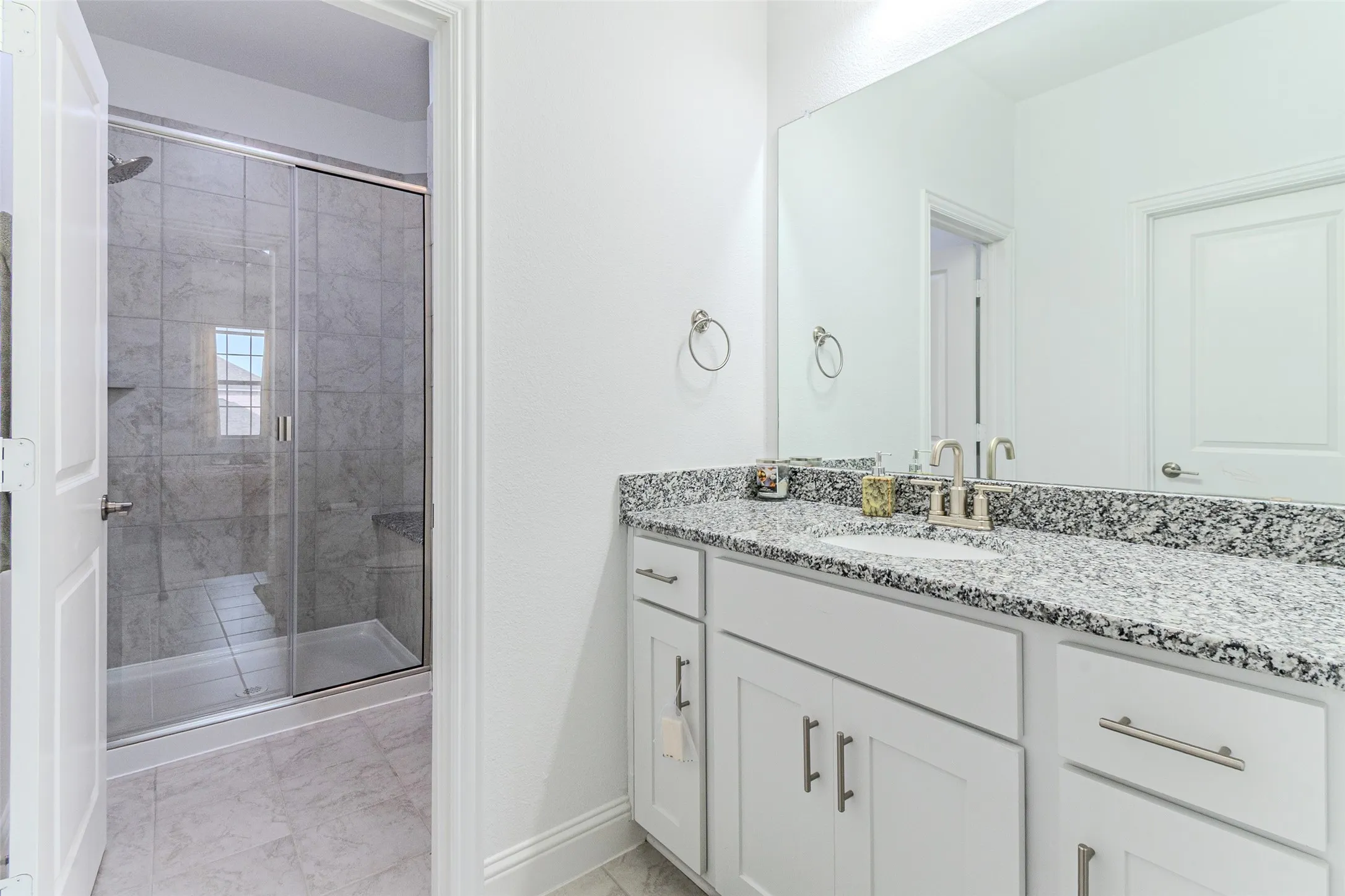 Vanity with stone countertop and undermount sink