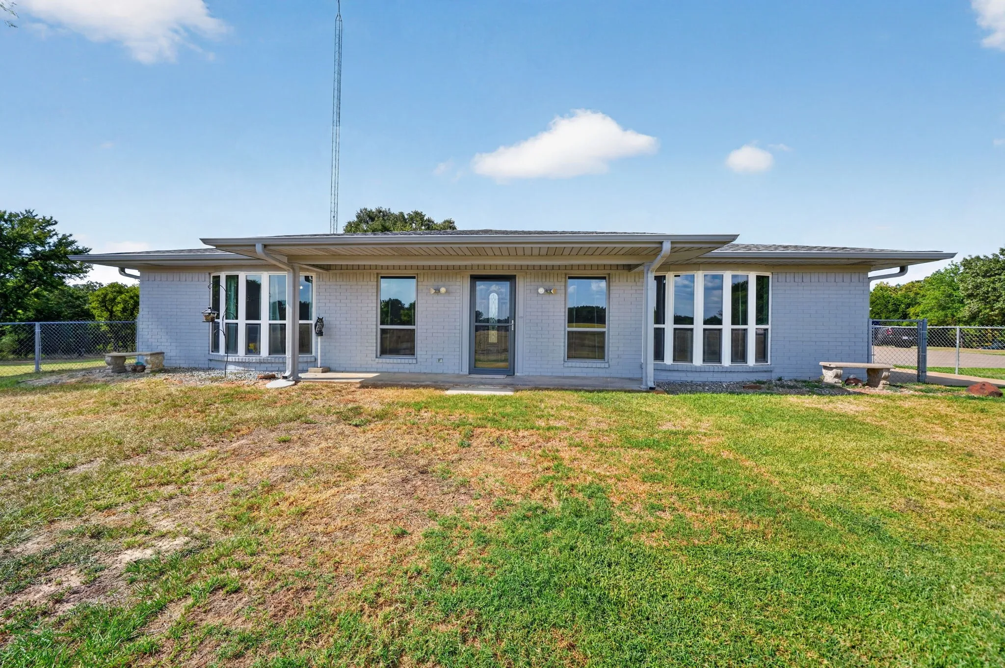 Light gray brick exterior with a covered front entry