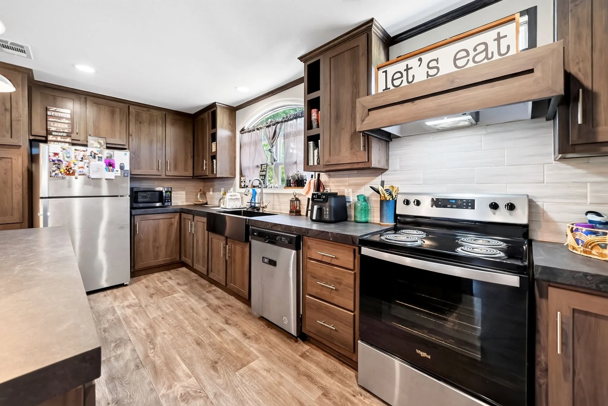 Wood-finish flooring with dark wood cabinetry