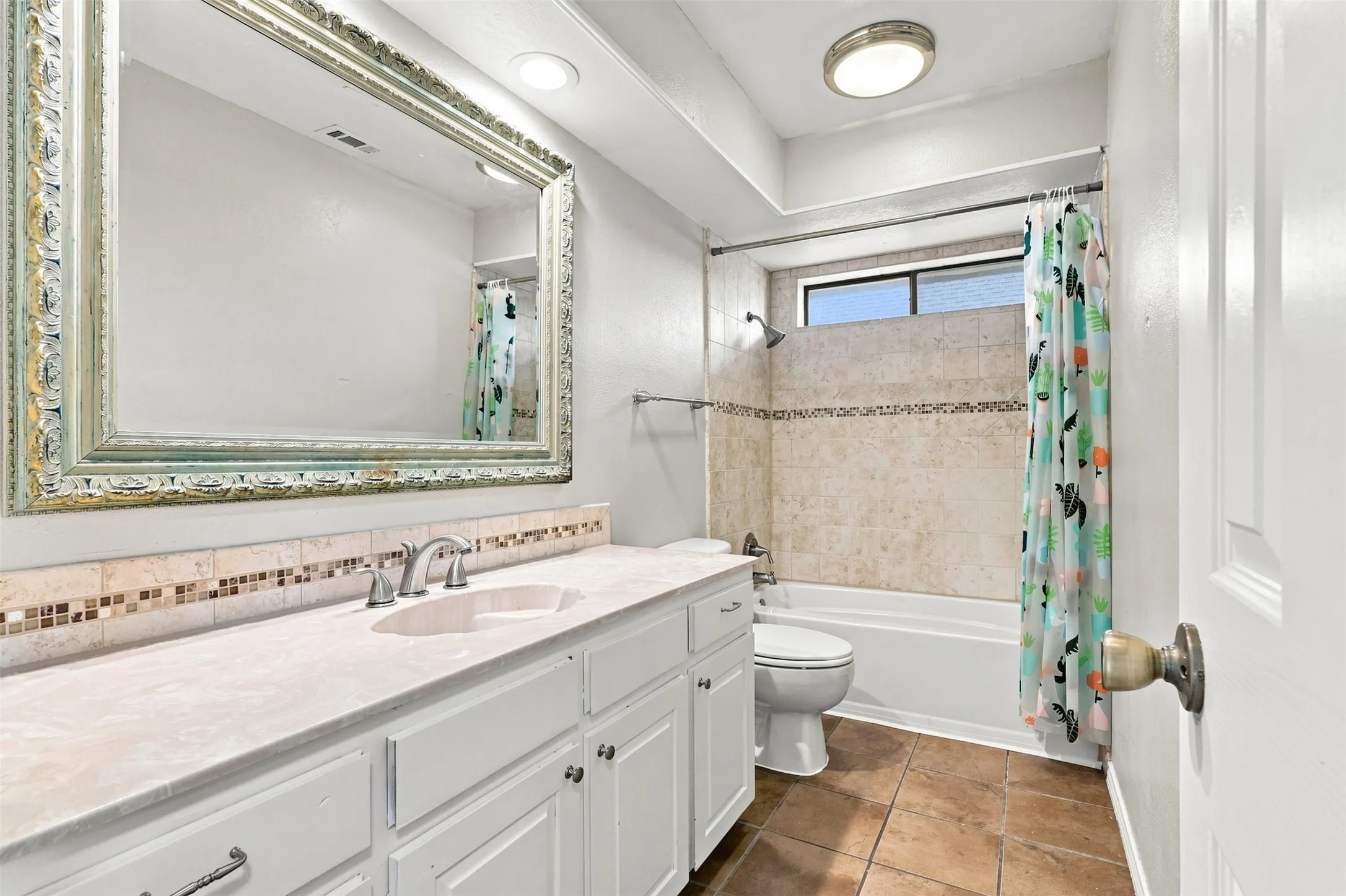 Tray ceiling with recessed lighting and a ceiling fan