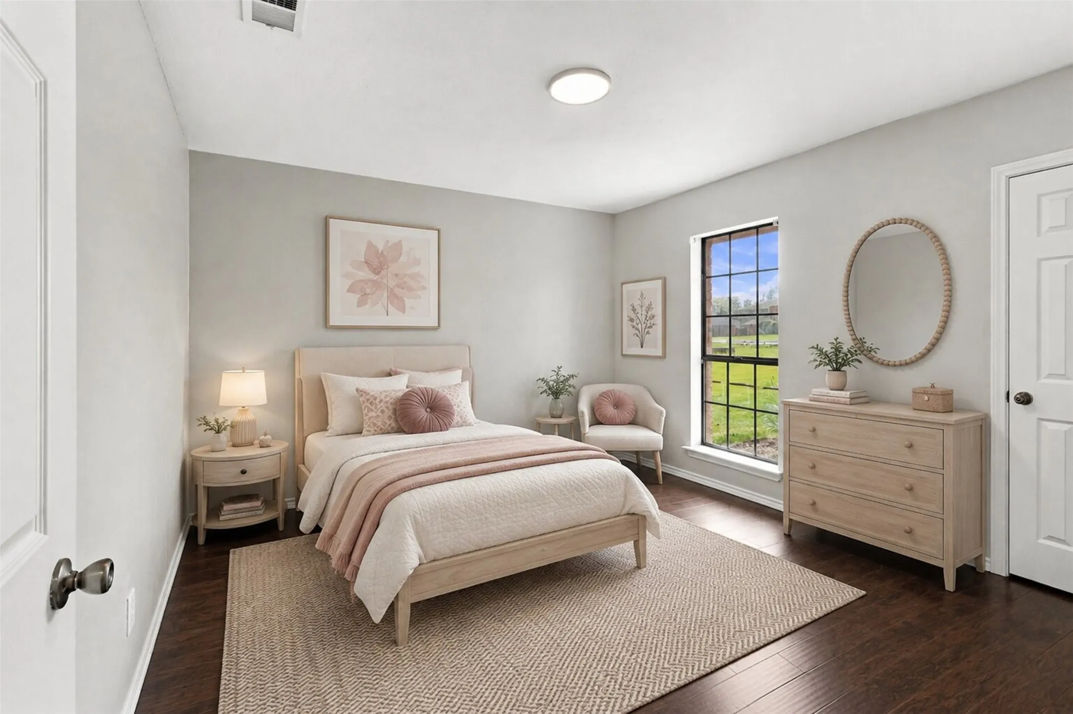 Hardwood flooring, light gray wall tones, recessed lighting, and a large window with exterior visibility