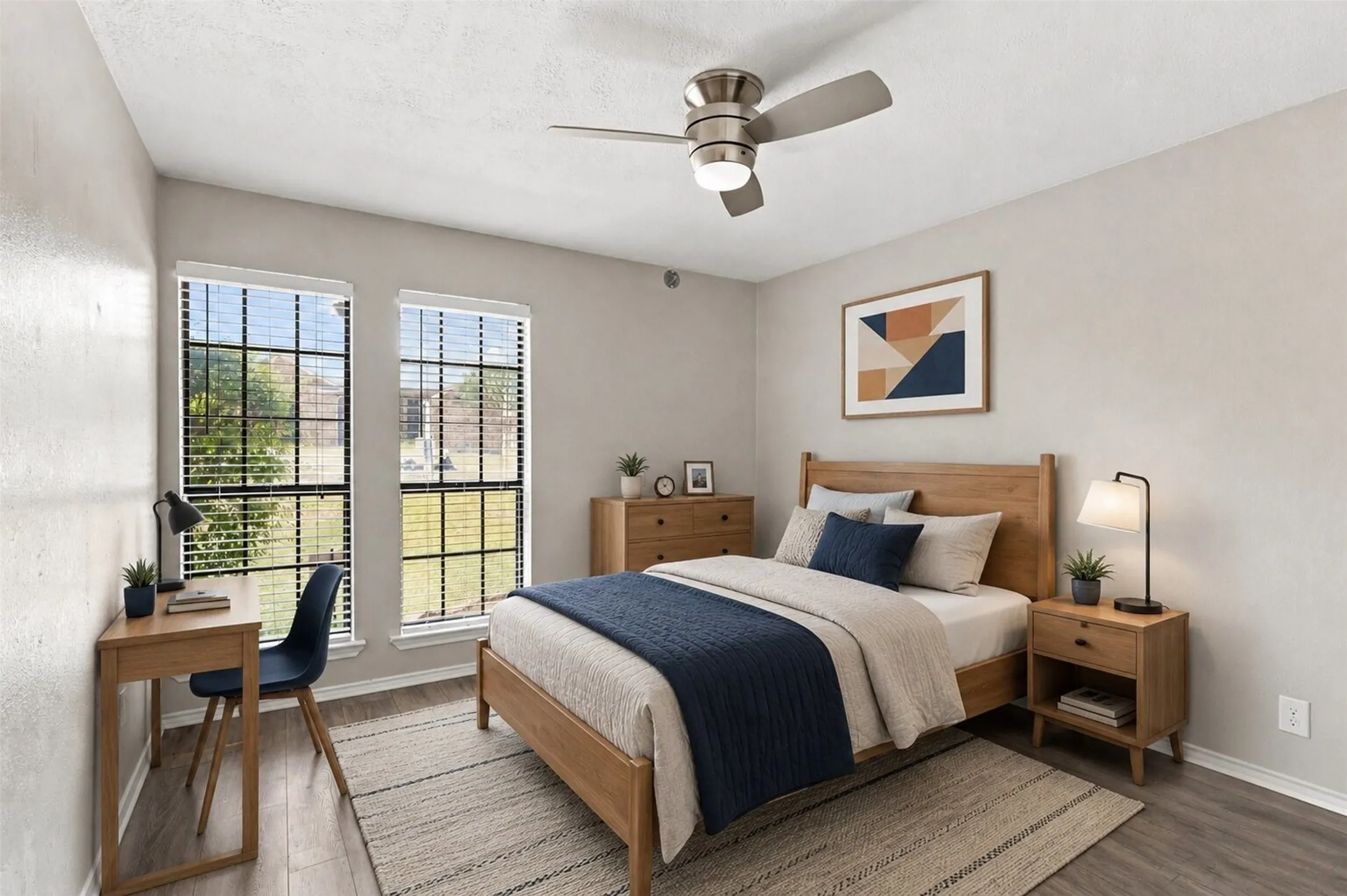 Hardwood flooring, light gray wall tones, recessed lighting, and a large window with exterior visibility