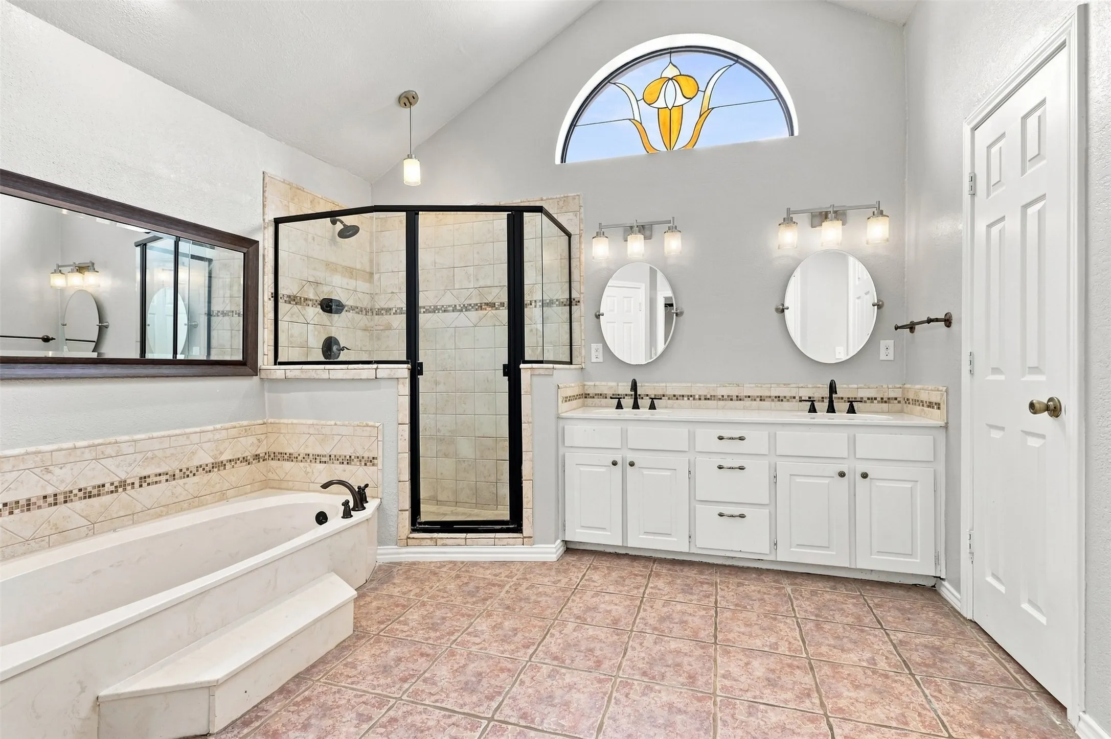 Double vanity with white cabinetry and integrated sinks