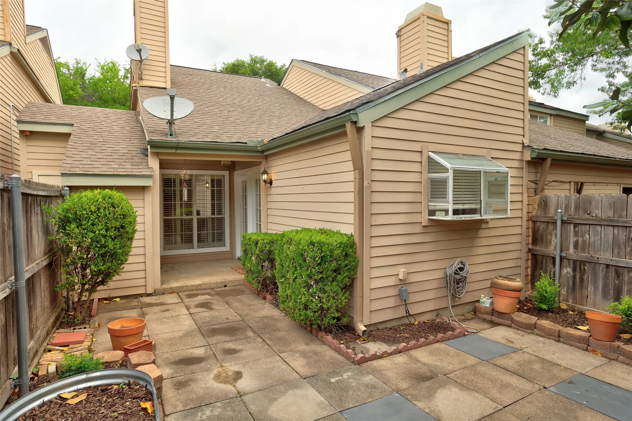 Landscaped with covered porch.