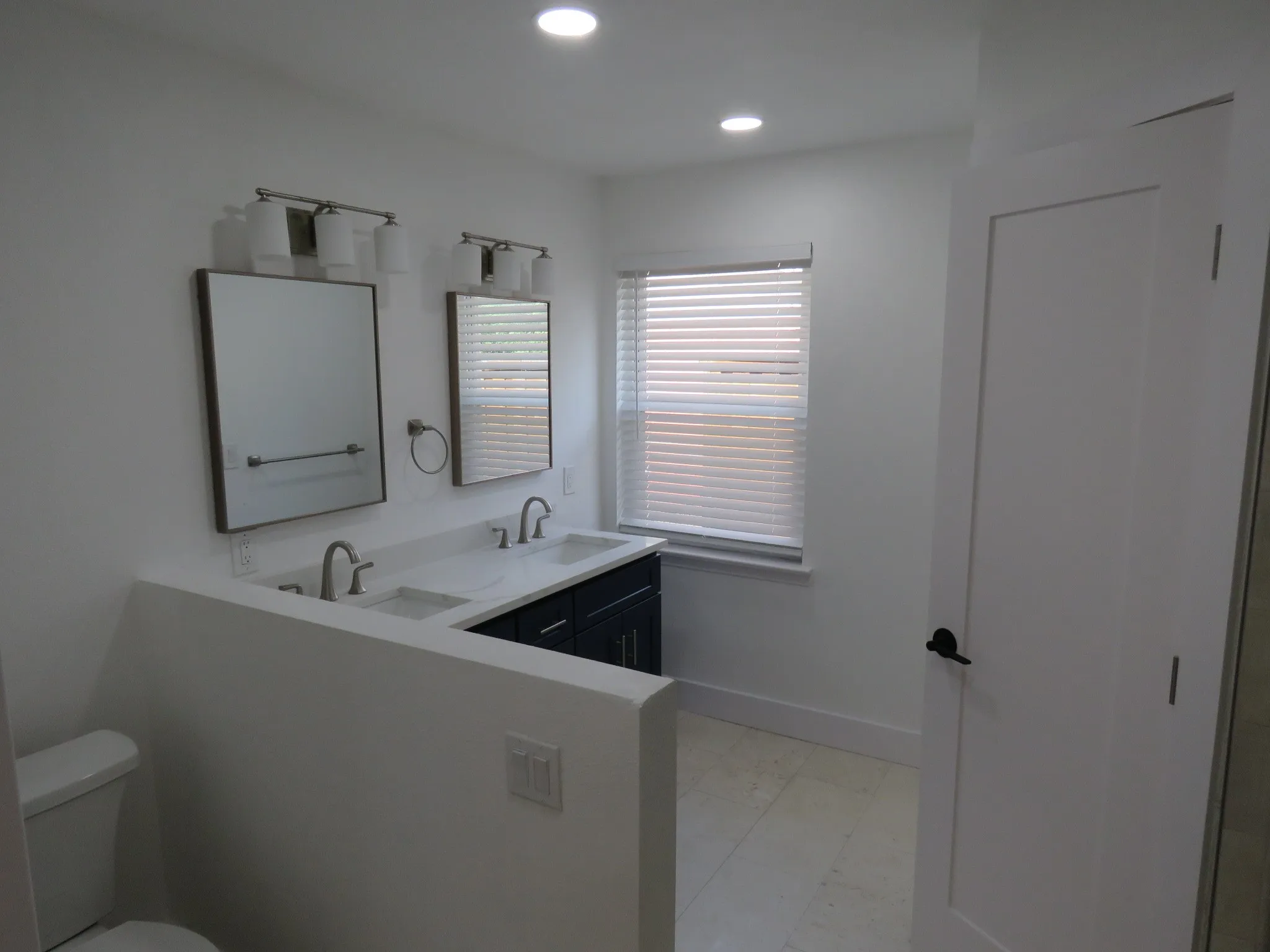 Primary Bathroom with double sinks and a shower
